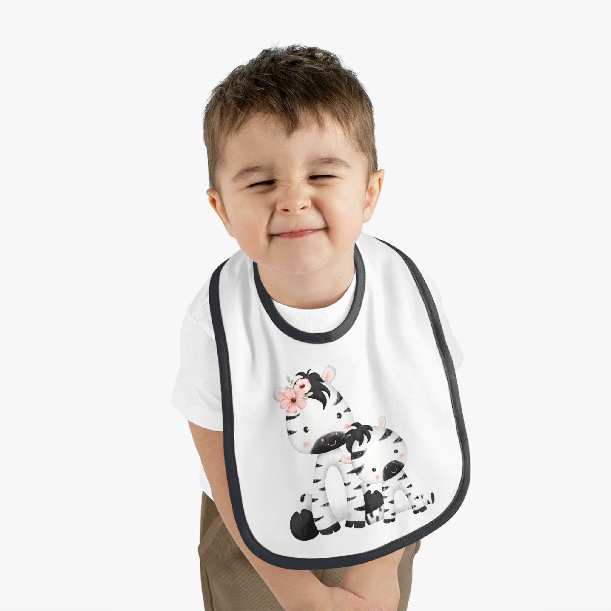 Toddler wearing Printify eco-friendly baby bib with cute zebra design and black trim