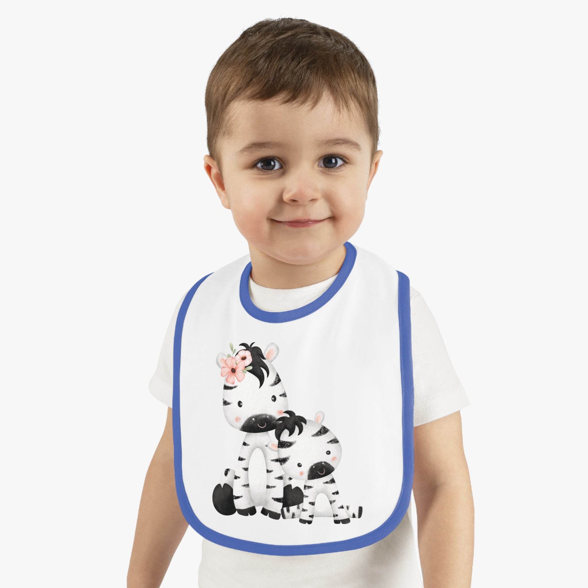 Toddler wearing Printify eco-friendly baby bib with blue trim and cute zebra design