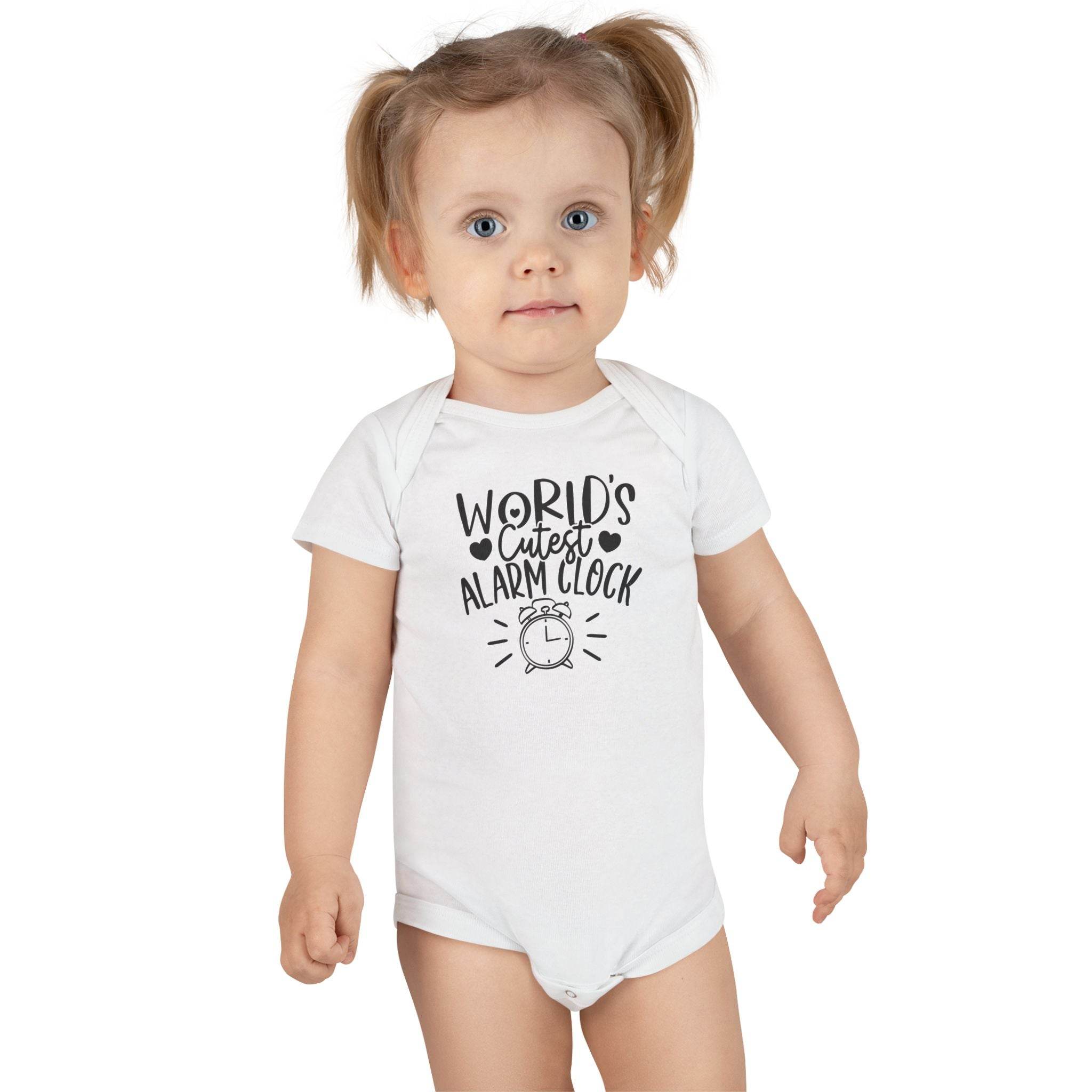 Baby wearing a white eco-friendly baby onesie with worlds cutest alarm clock print