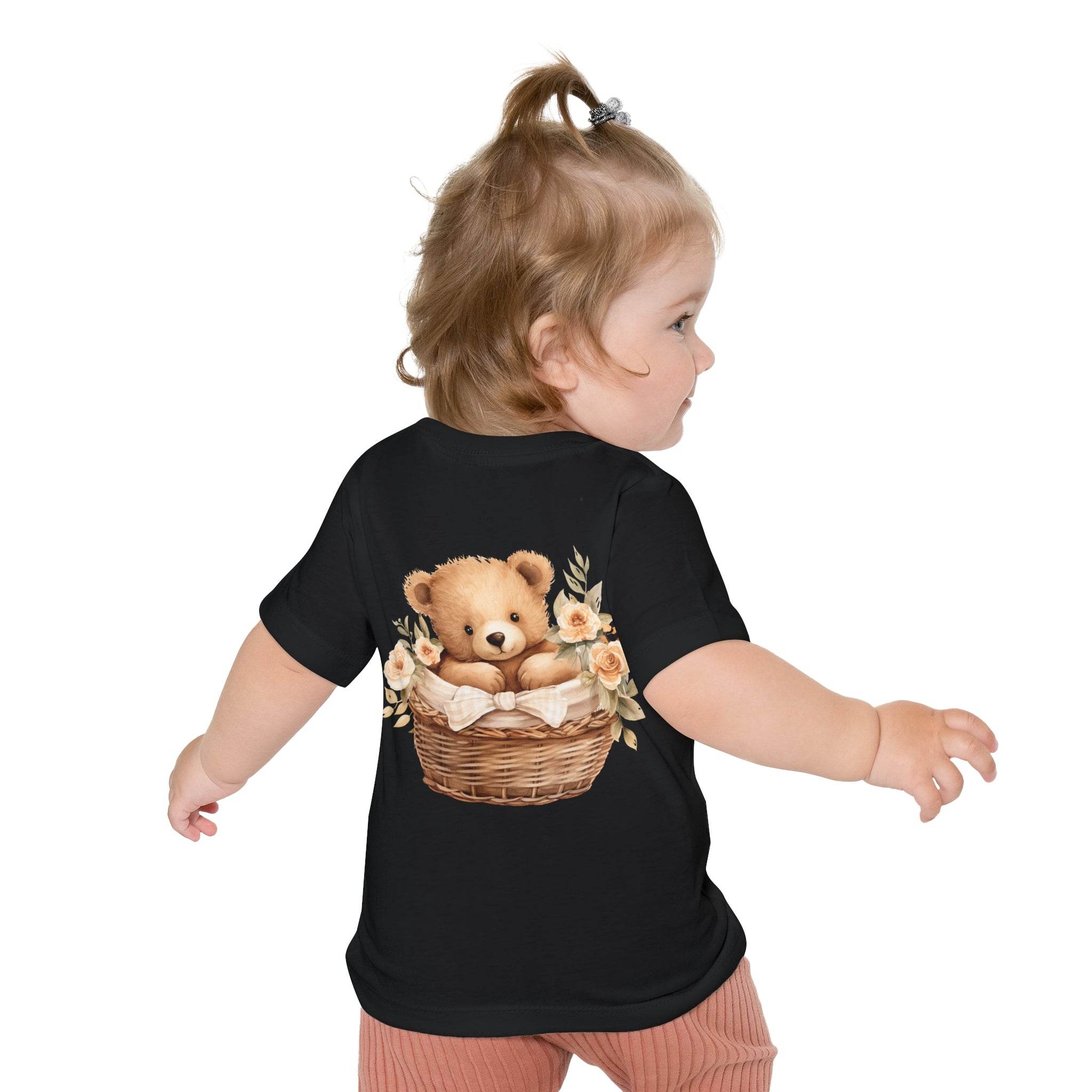 Toddler wearing black eco-friendly baby t-shirt with teddy bear in basket design on back