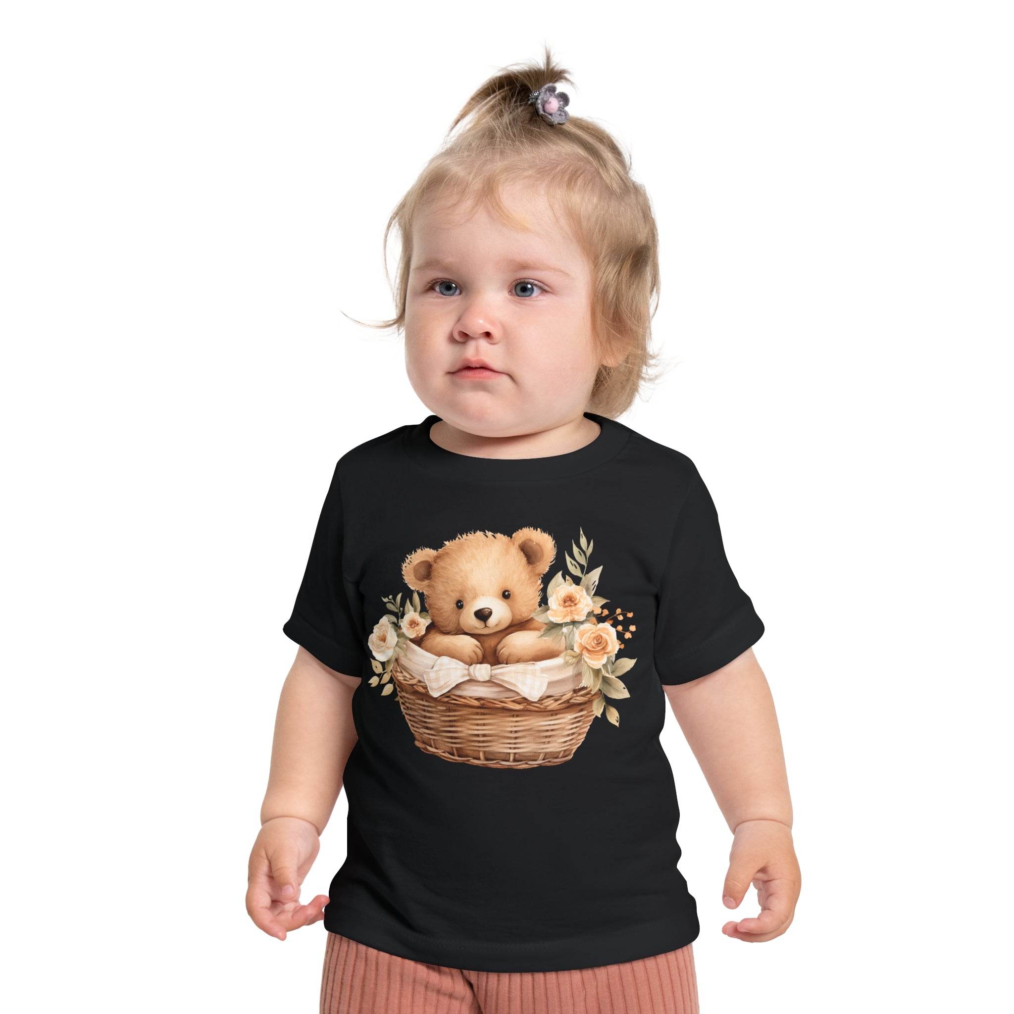 Toddler wearing black eco-friendly baby t-shirt with teddy bear in basket and floral design