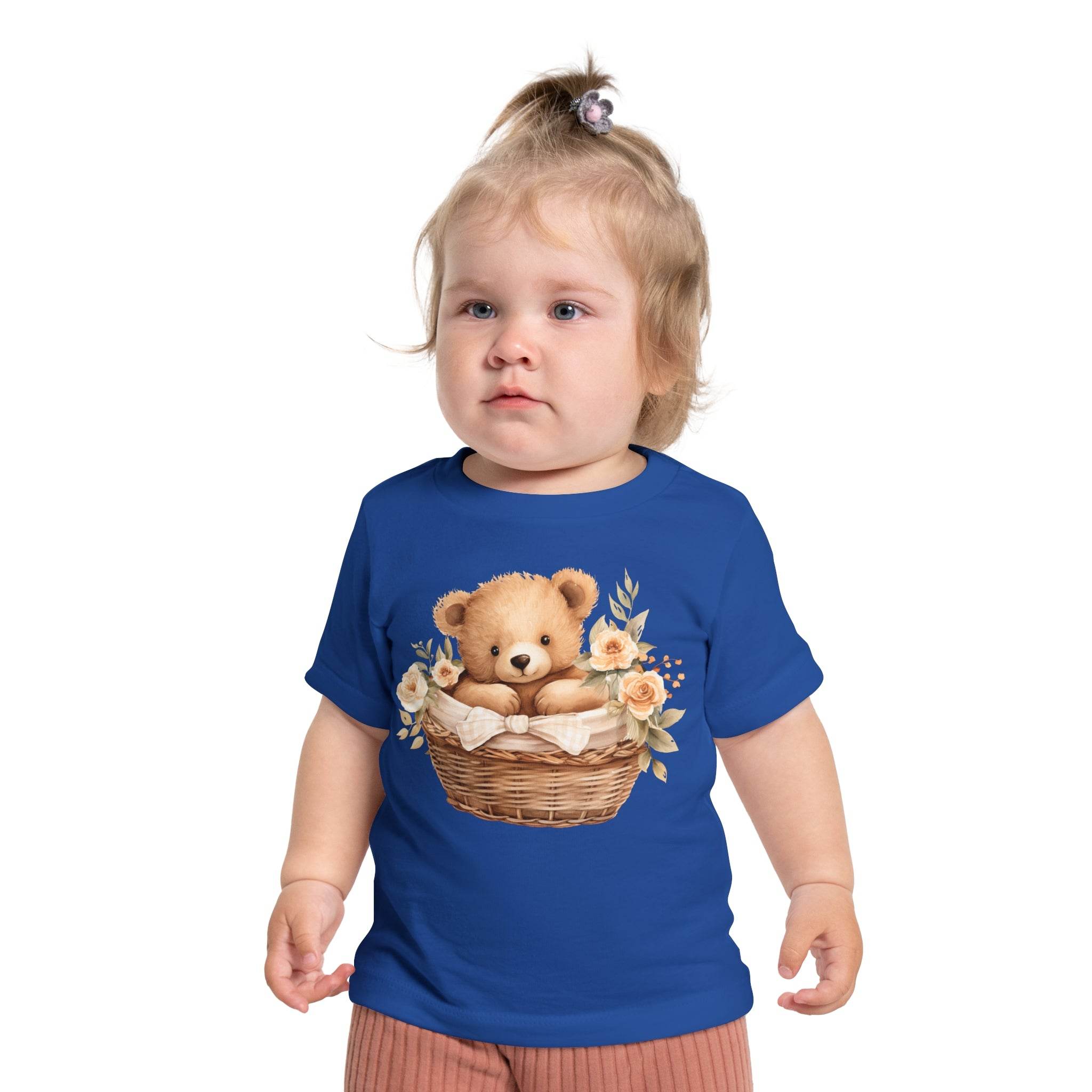 Toddler wearing an eco-friendly baby t-shirt in blue with teddy bear and flower basket design