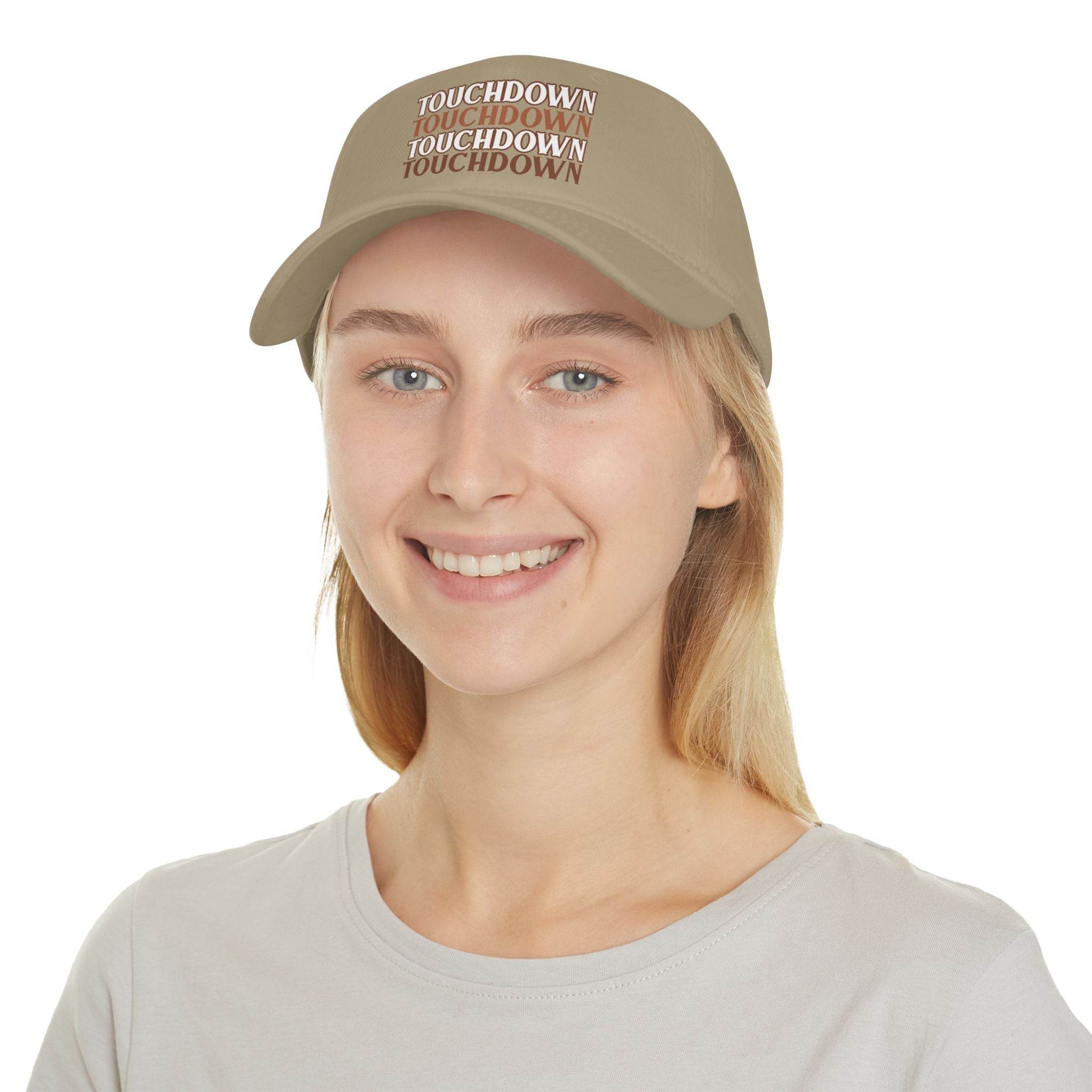 Printify eco-friendly baseball cap in beige with touchdown text worn by smiling woman