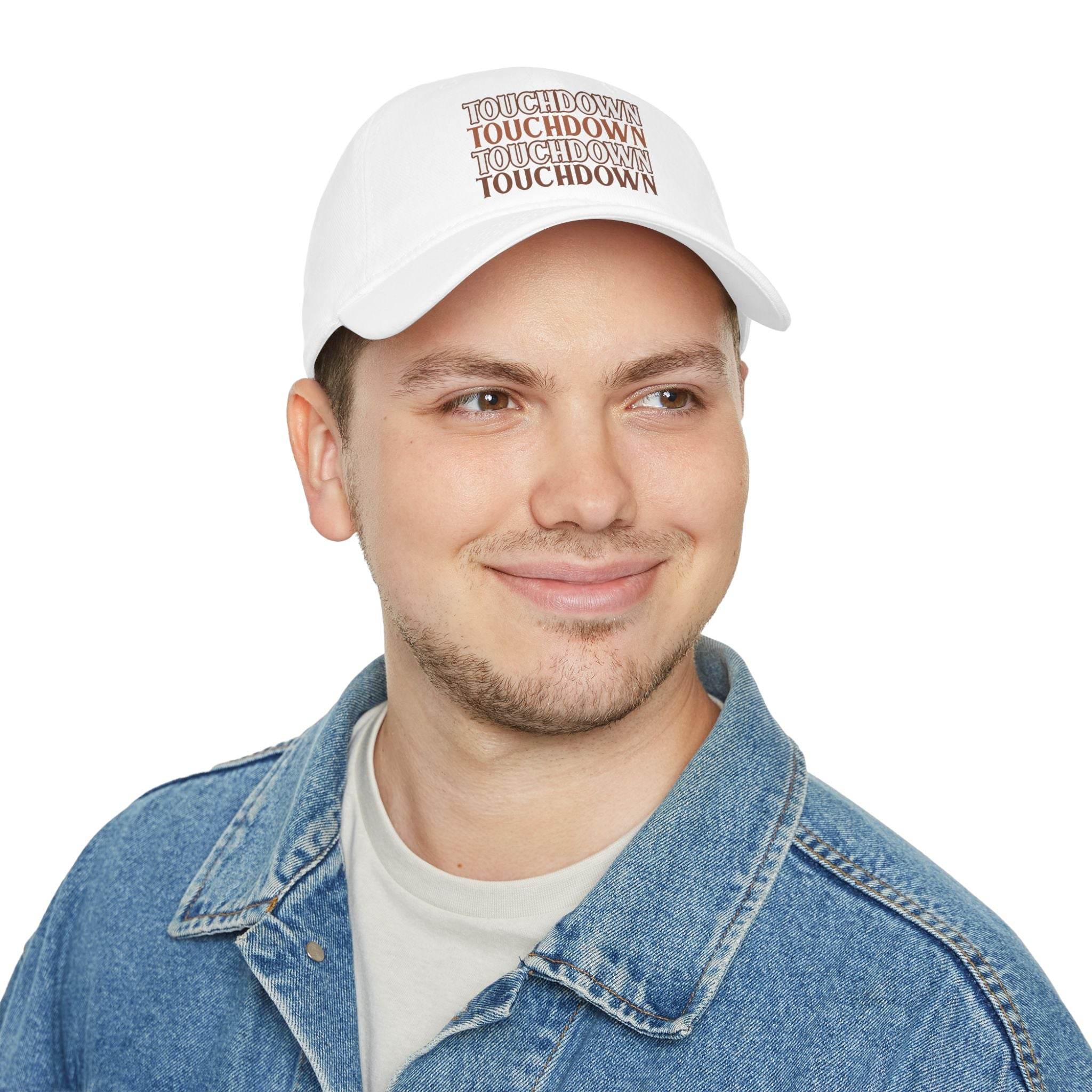 White eco-friendly baseball cap with Touchdown print worn by man in denim jacket
