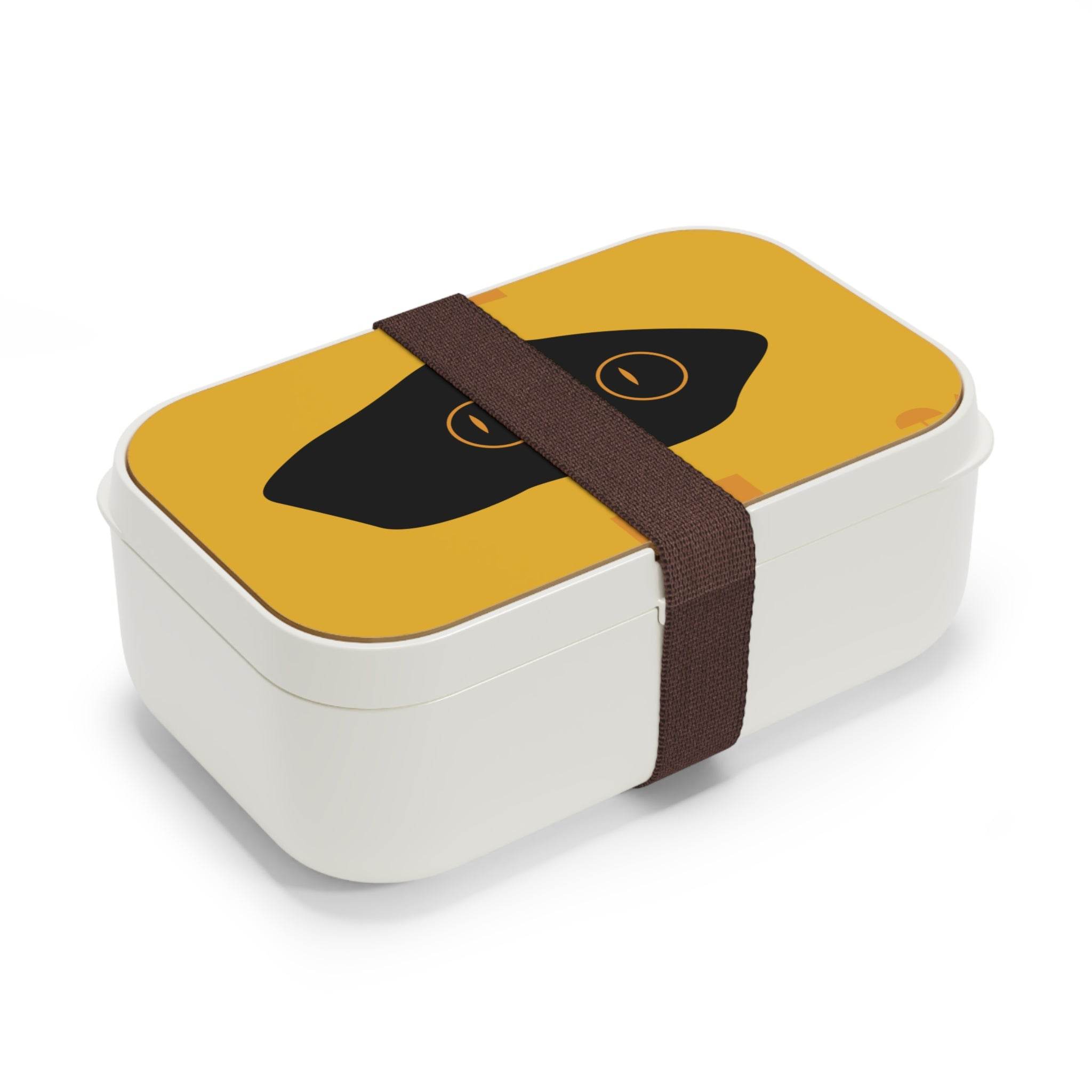 Printify eco-friendly bento lunch box with yellow lid and black cat eye design secured by brown strap