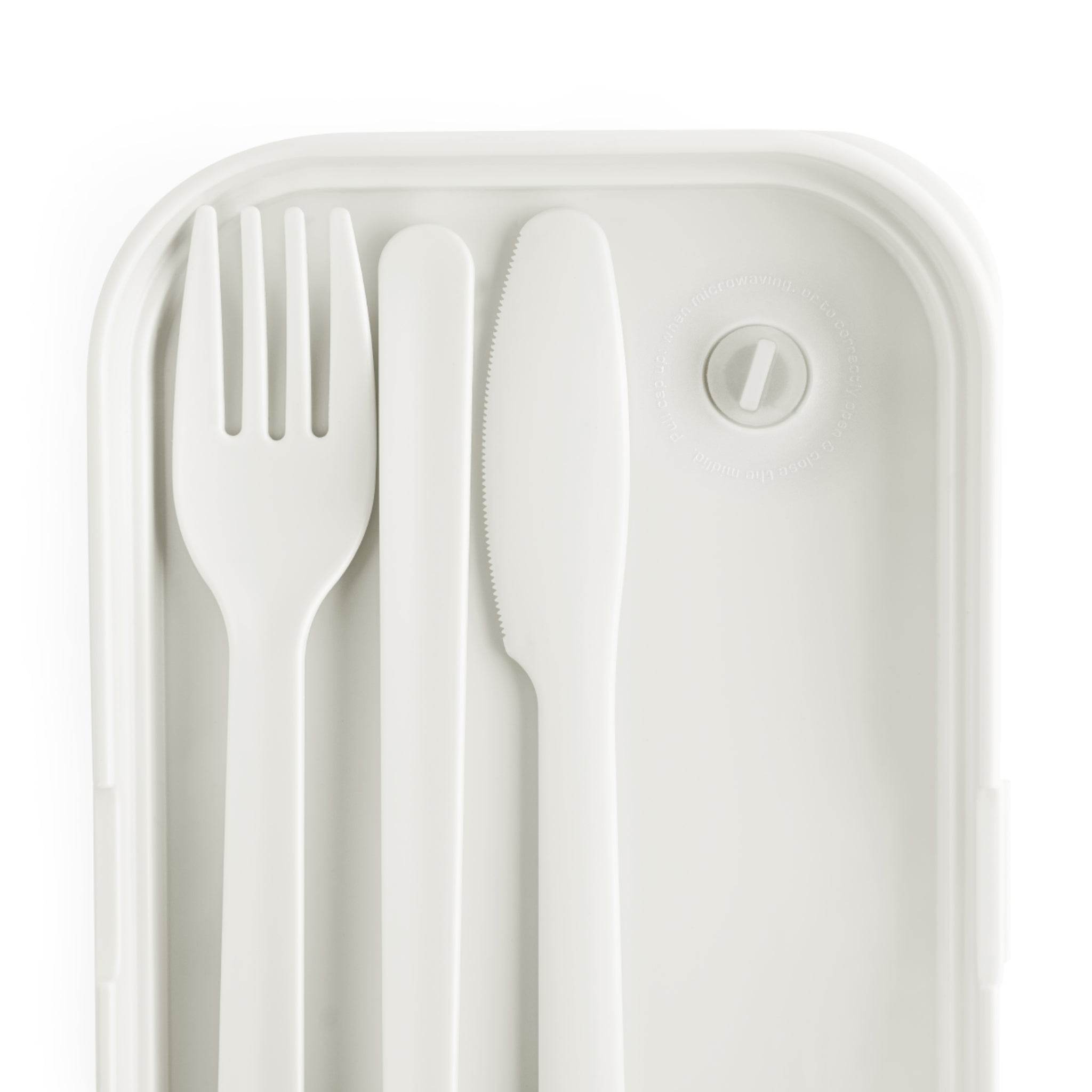 White eco-friendly bento lunch box with matching fork, knife, and spoon kitchen accessories