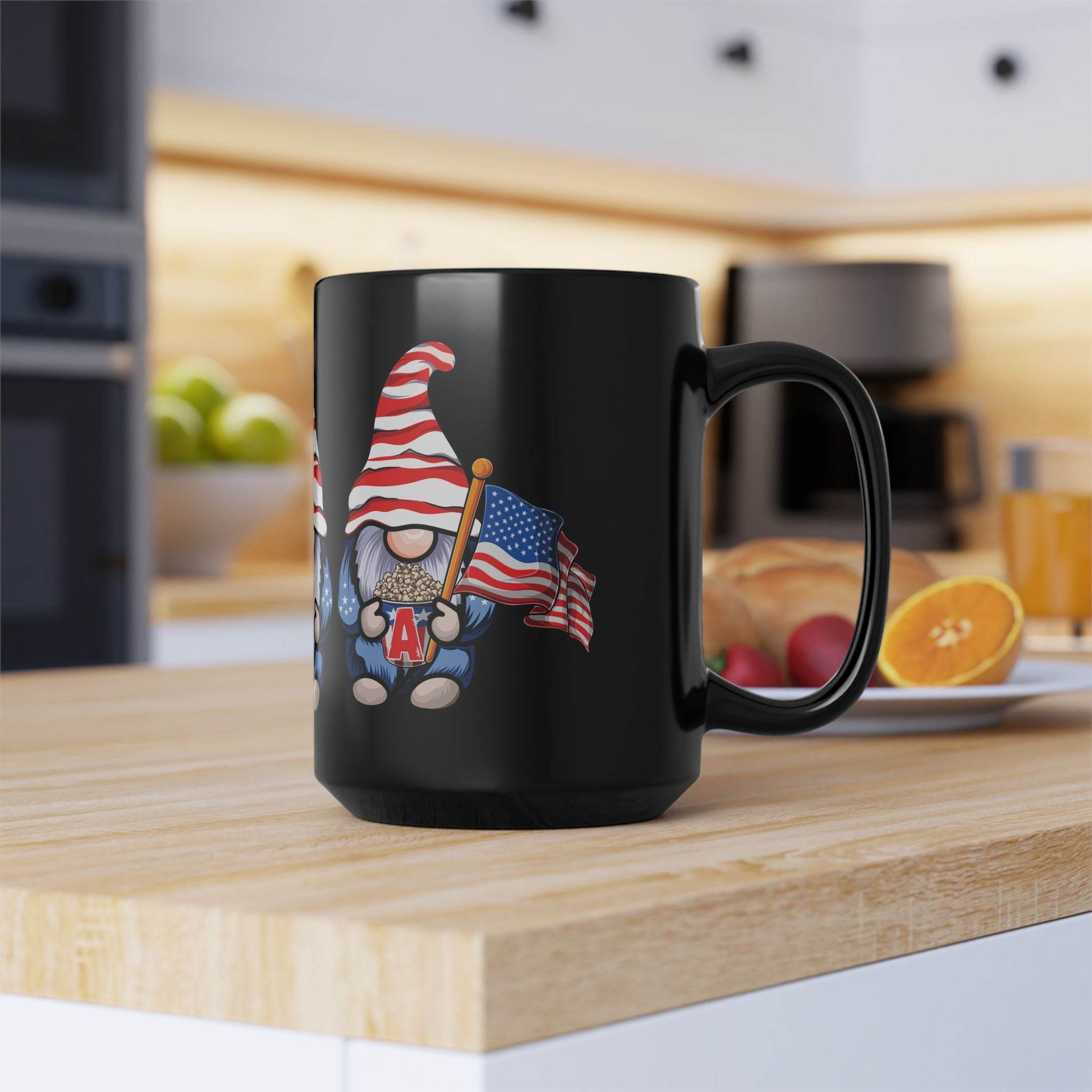 Printify eco-friendly black mug with patriotic gnome holding an American flag on wooden kitchen counter