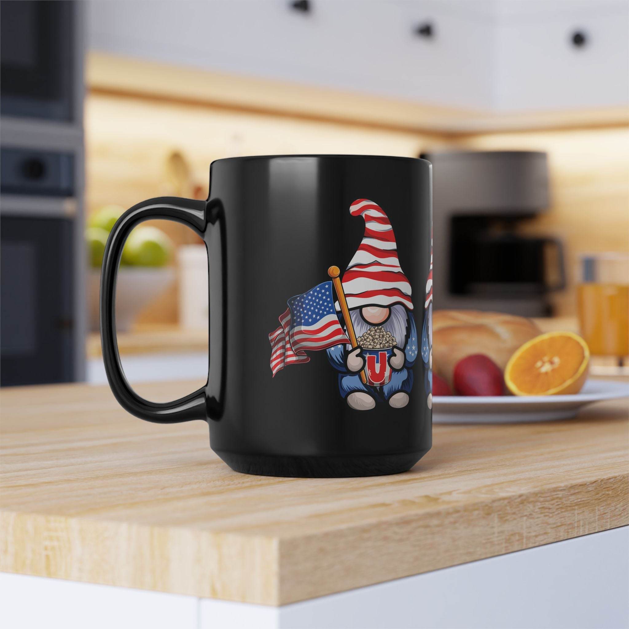 Printify eco-friendly black mug with patriotic gnome holding an American flag on a kitchen counter