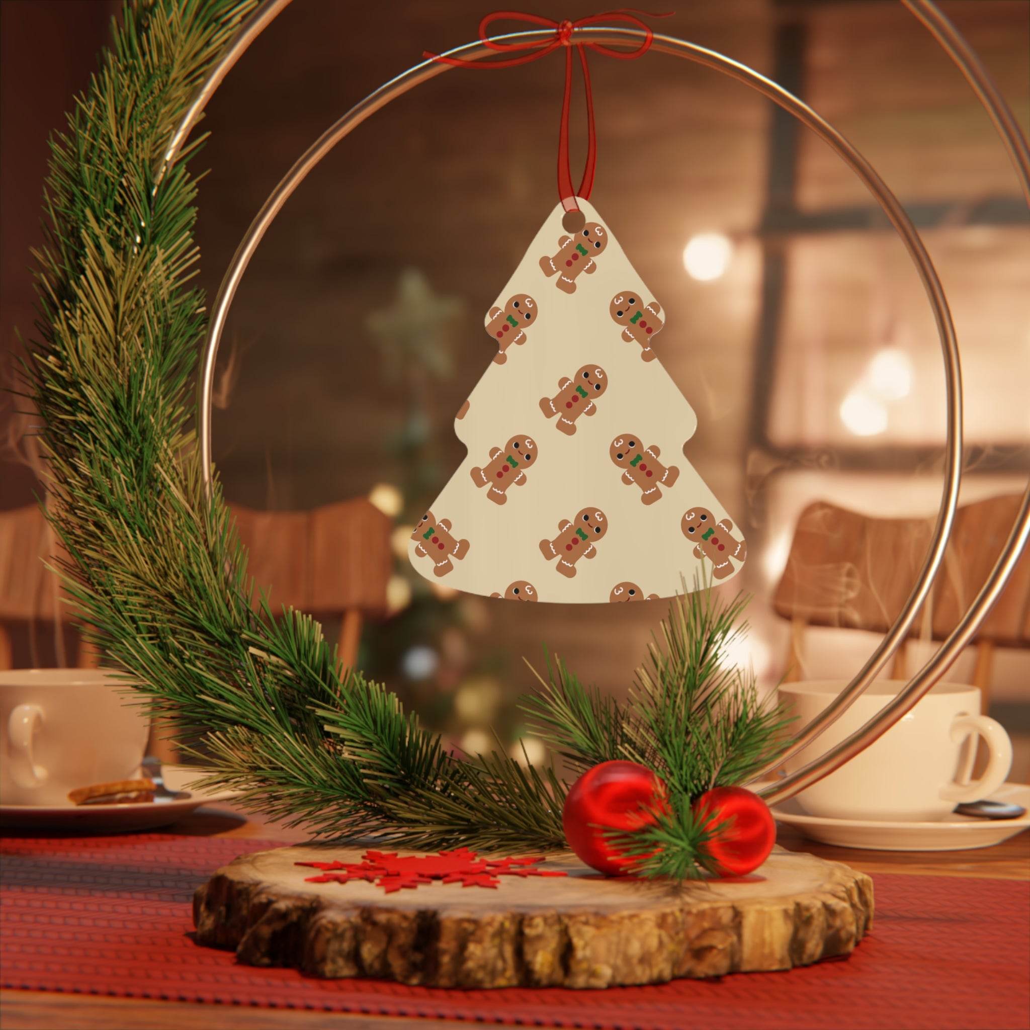 Eco-friendly Christmas ornaments featuring gingerbread tree decoration with pine and red baubles on wooden base