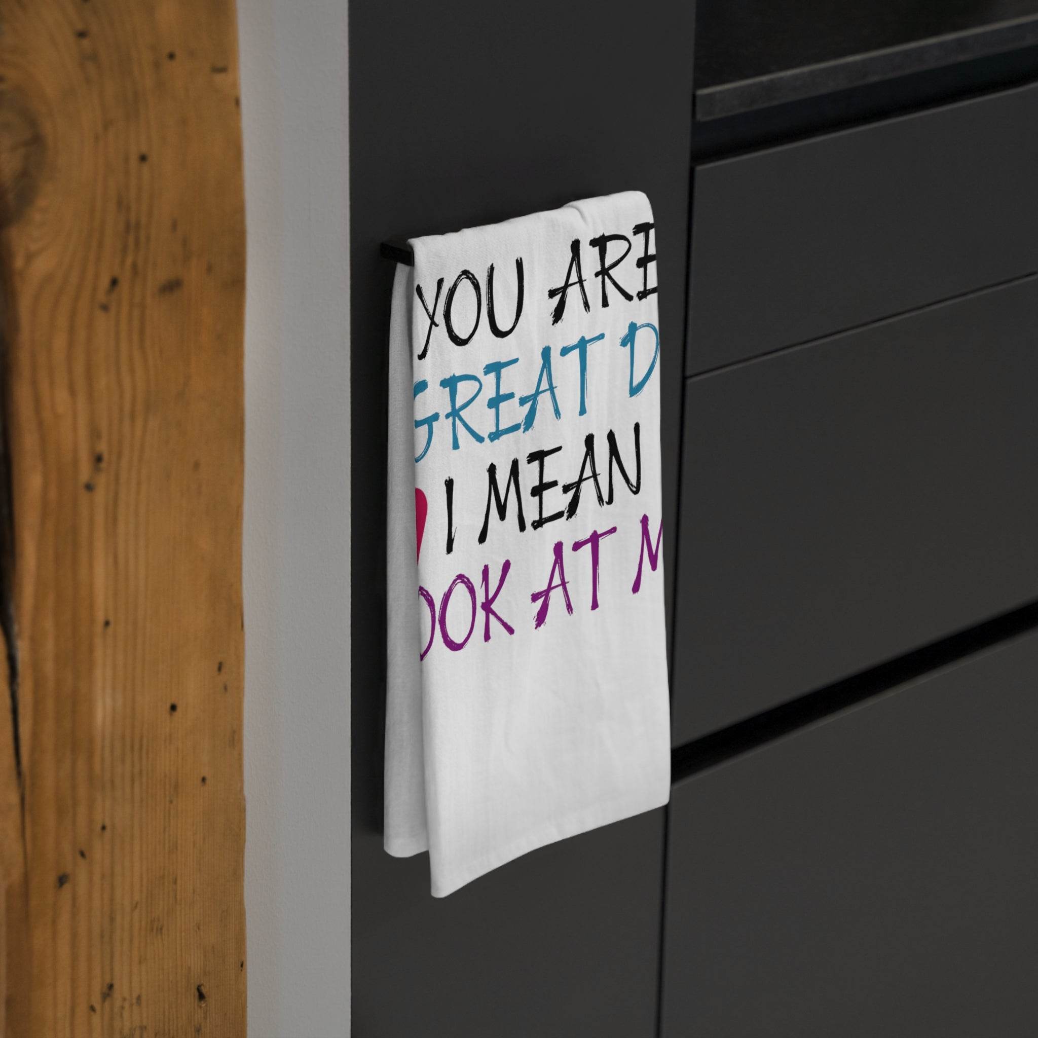 Printify eco-friendly dad tea towel with colorful text hanging on black kitchen cabinet