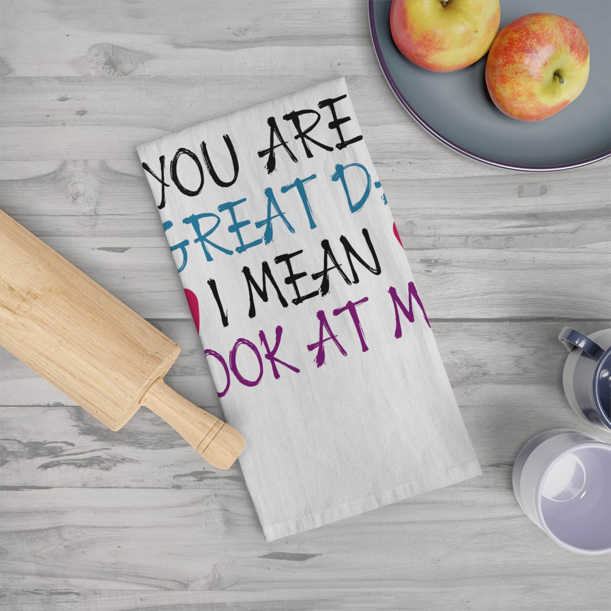 Printify eco-friendly dad tea towel with colorful text design on wooden kitchen counter with rolling pin and fruits