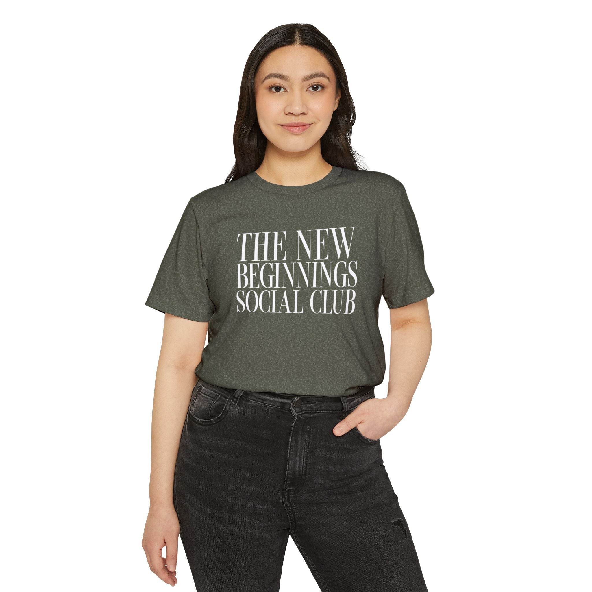 Printify eco-friendly fashion tee with The New Beginnings Social Club text worn by woman
