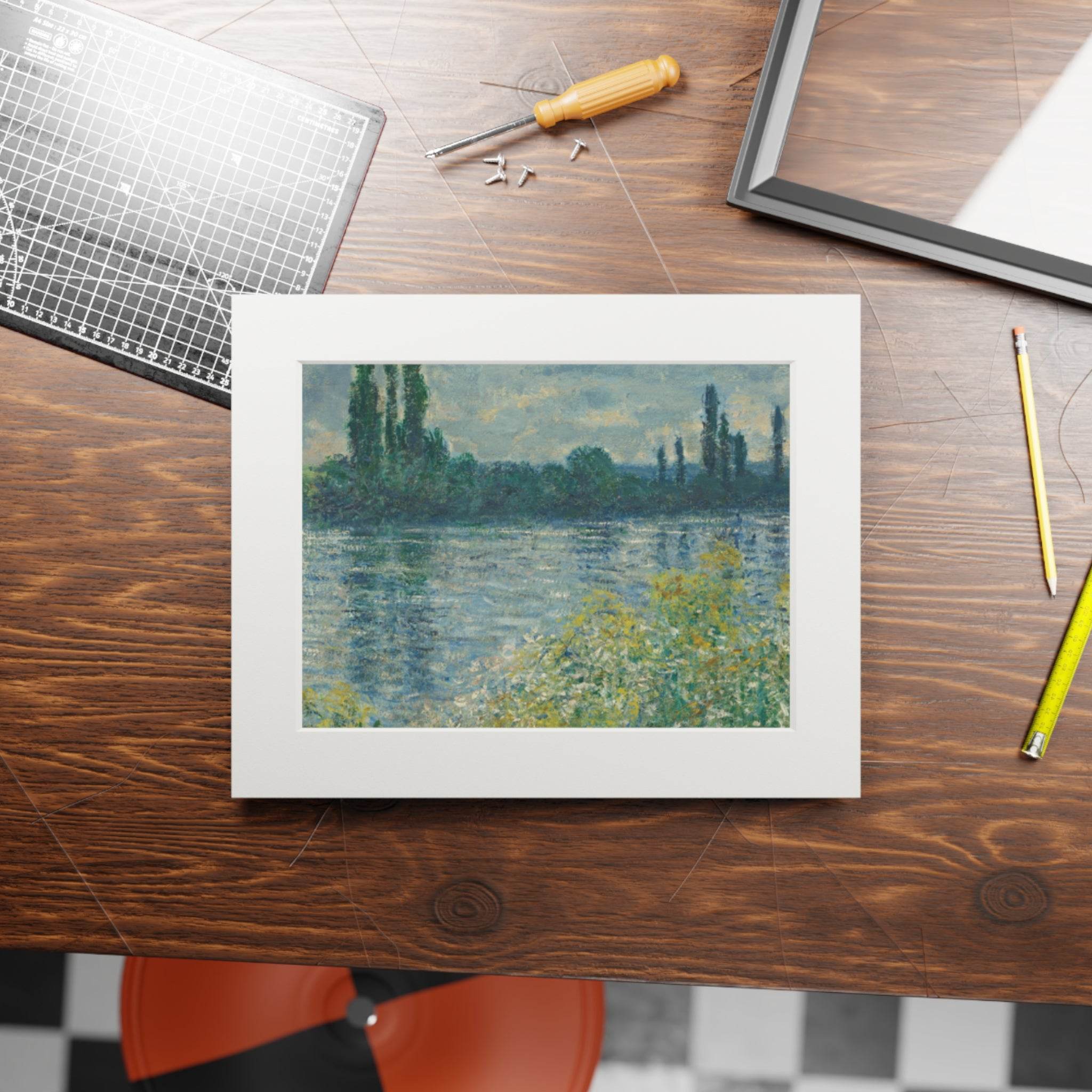 Printify poster featuring eco-friendly fine art prints of a landscape with trees and water on a wooden desk