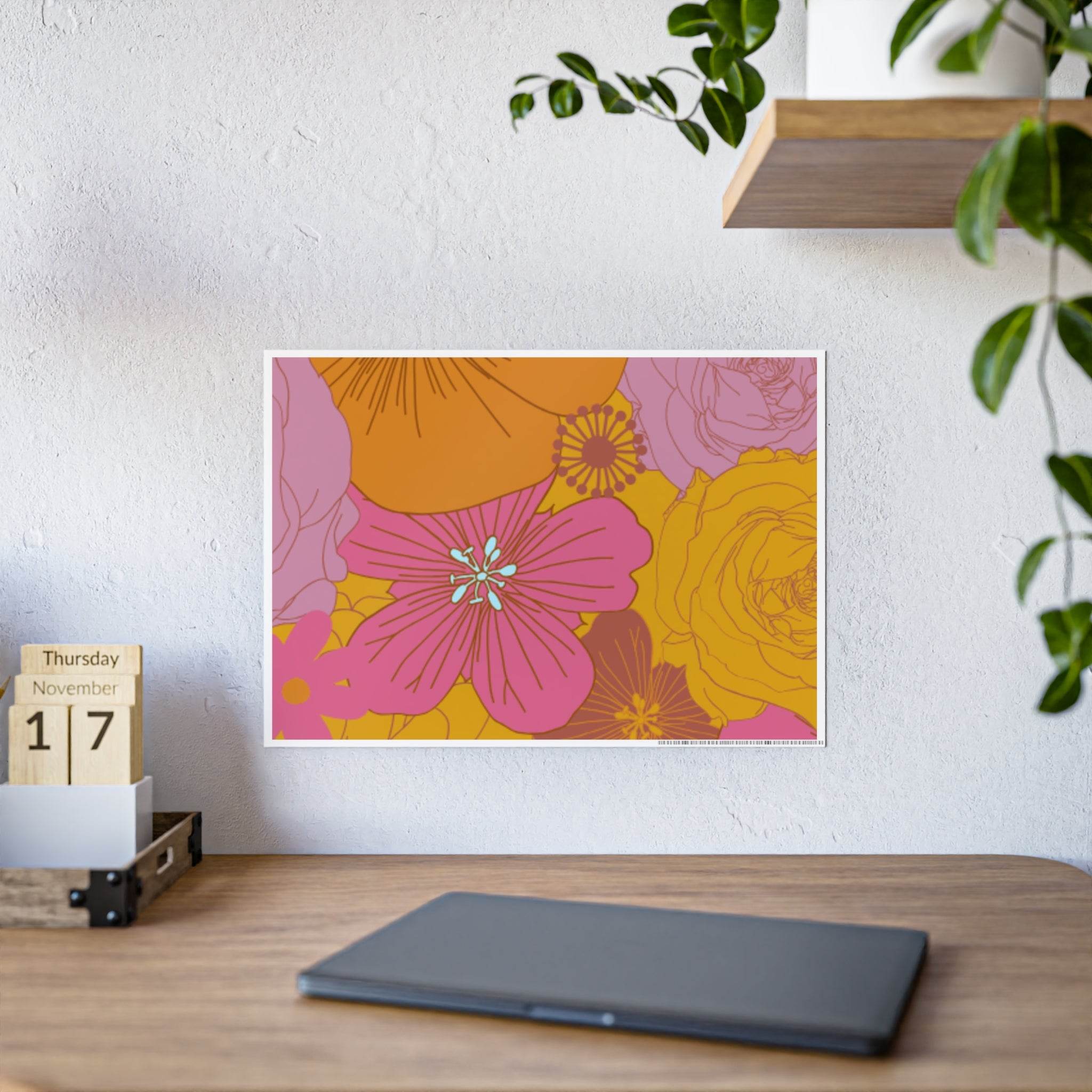 Printify eco-friendly flower posters with vibrant pink and yellow floral design on wall above desk