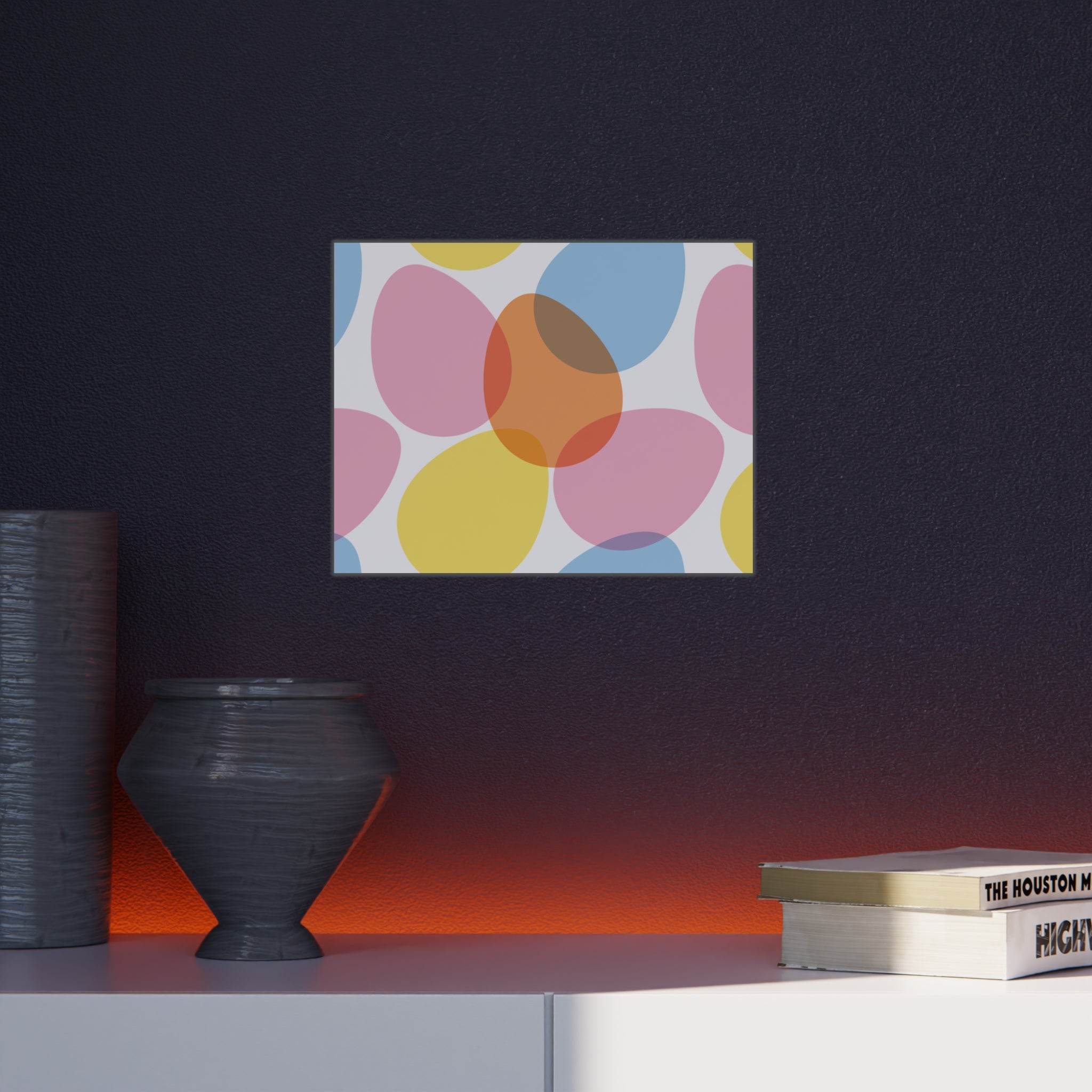 Colorful abstract art print on eco-friendly foam board displayed on dark wall above white shelf