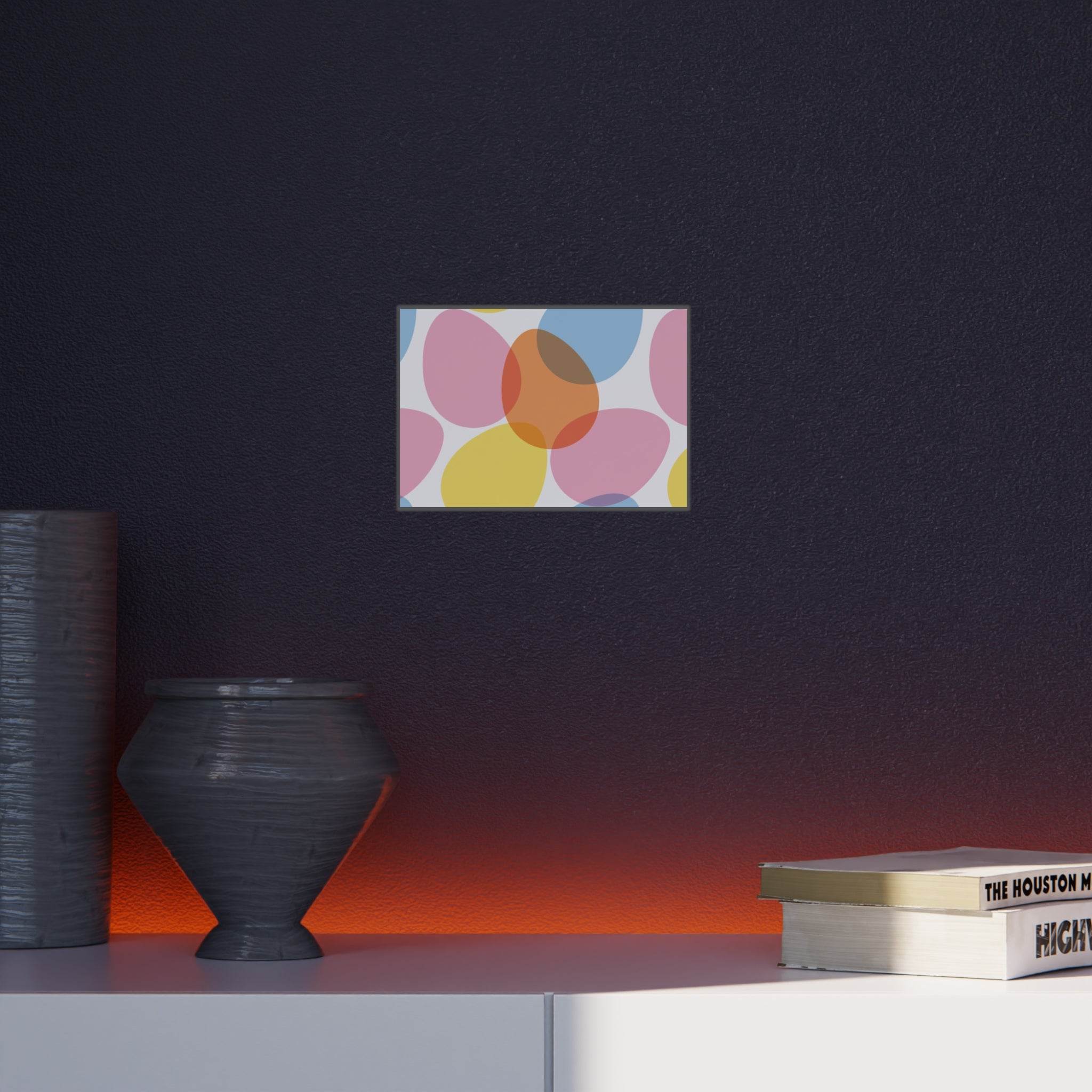 Printify home decor wall art on eco-friendly foam board with colorful abstract shapes above a shelf with vases and books