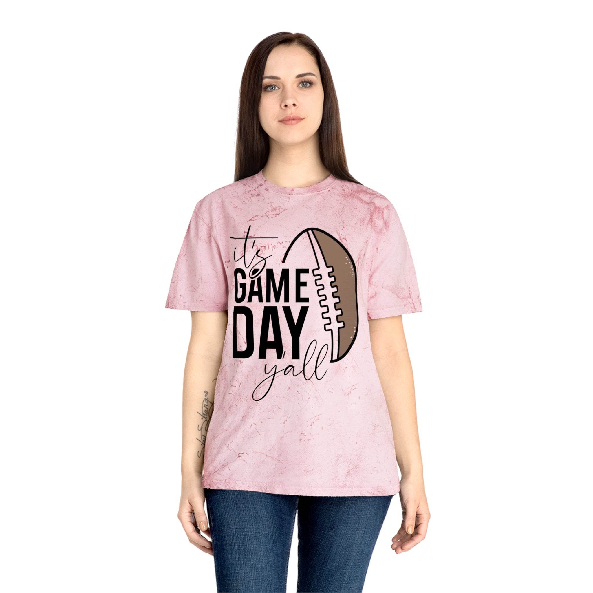 Woman wearing a pink eco-friendly game day t-shirt with football graphic and text design