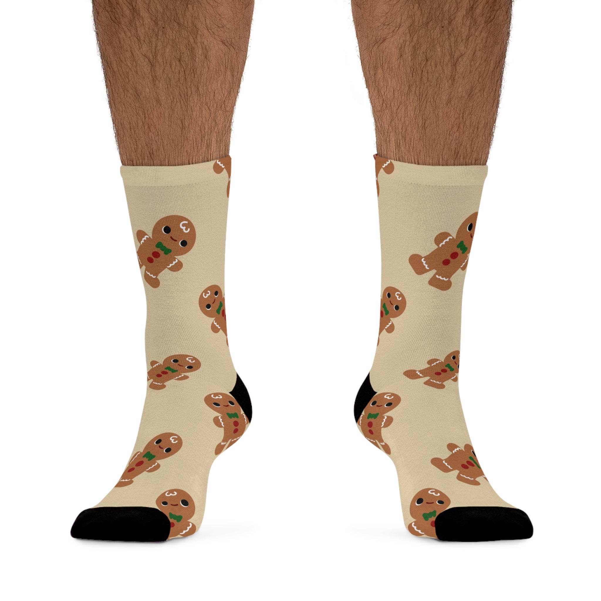 Printify eco-friendly ginger snaps socks featuring beige background with cute gingerbread man pattern and black heels and toes