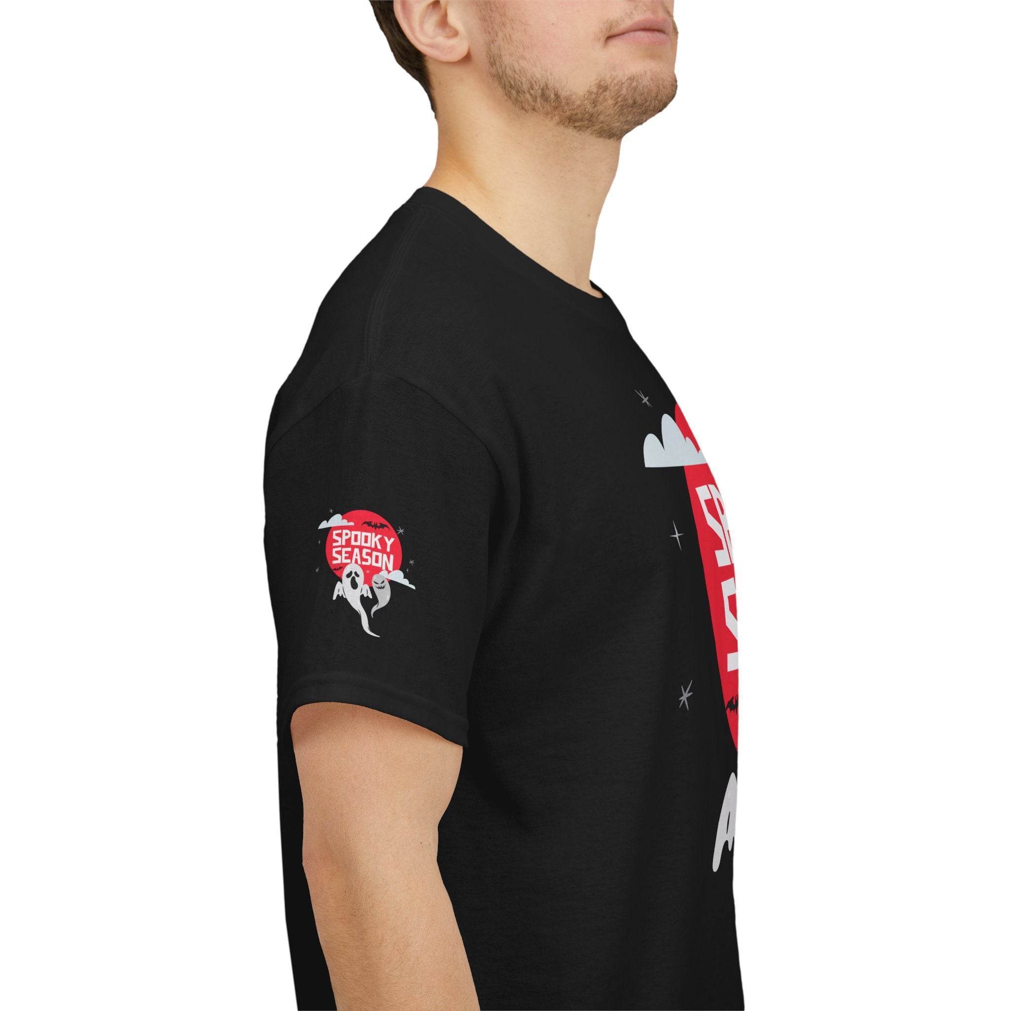 Black eco-friendly Halloween shirt by Printify with spooky season design on sleeve and chest