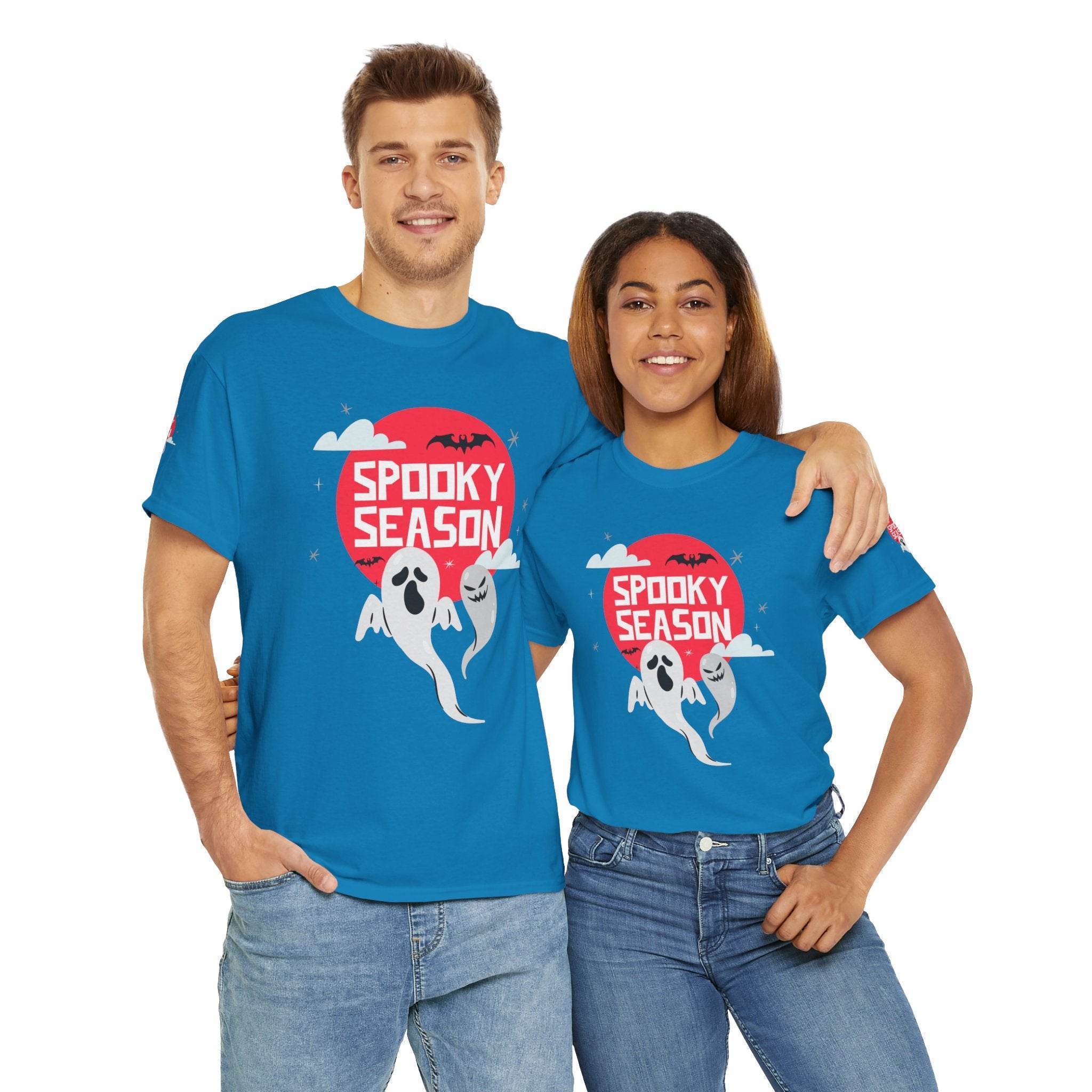 Printify eco-friendly Halloween shirt with spooky ghost design worn by smiling man and woman