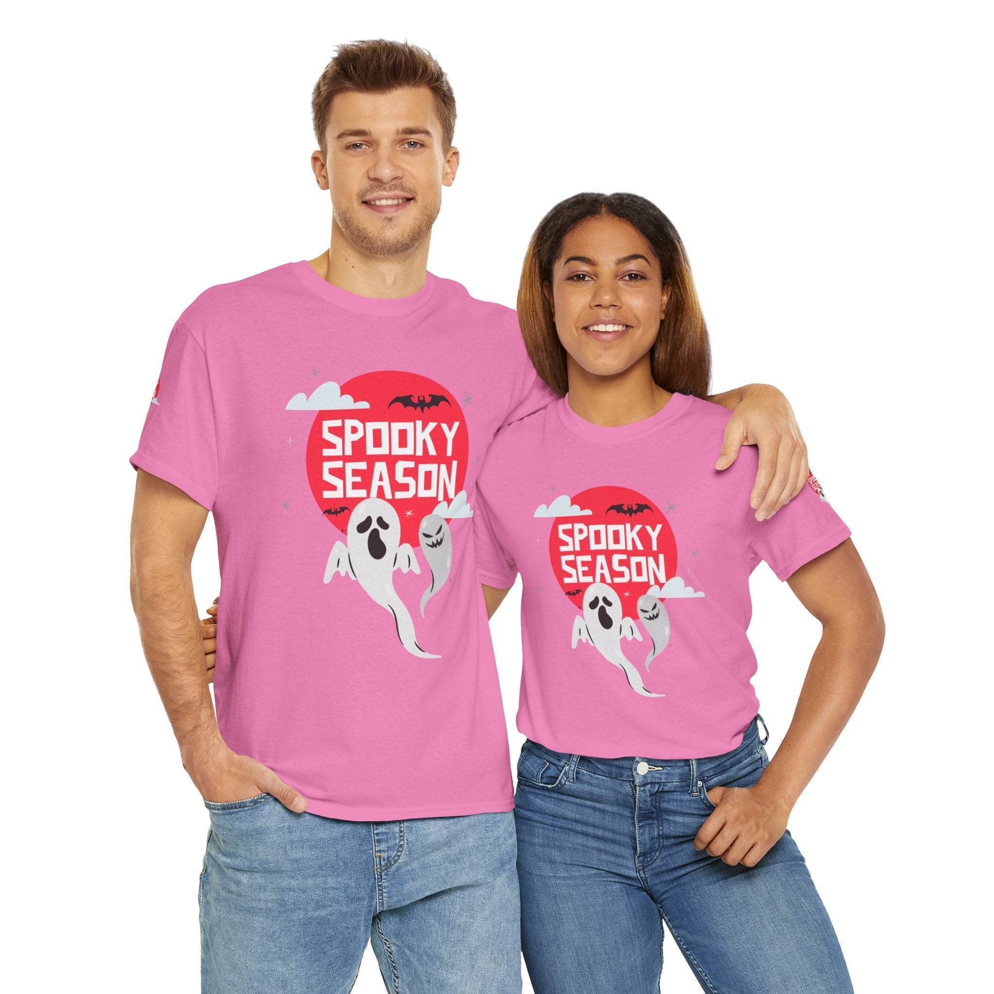 Printify eco-friendly Halloween shirt in pink with spooky season ghost design worn by smiling man and woman