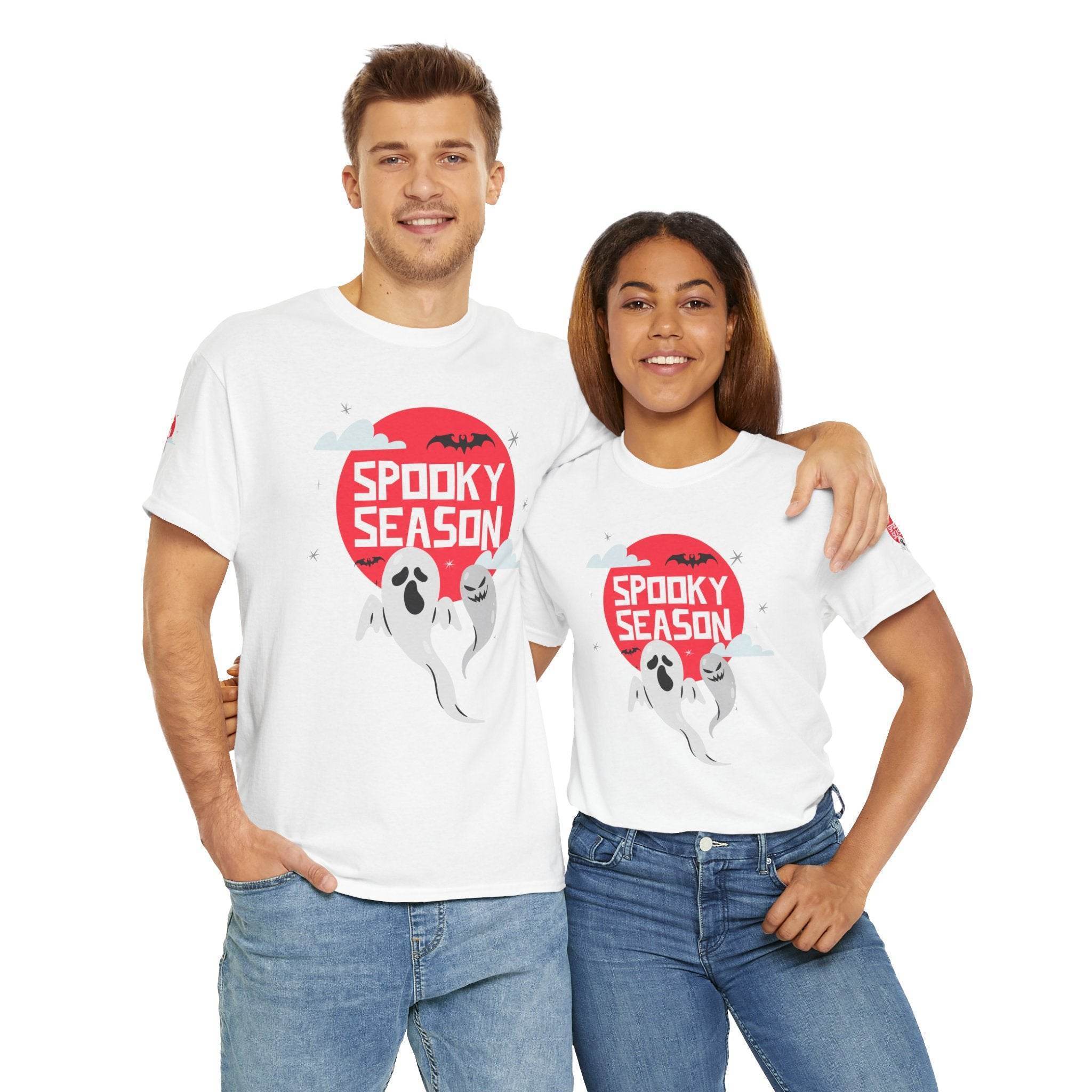 Printify eco-friendly Halloween shirt featuring spooky ghosts and red moon worn by man and woman