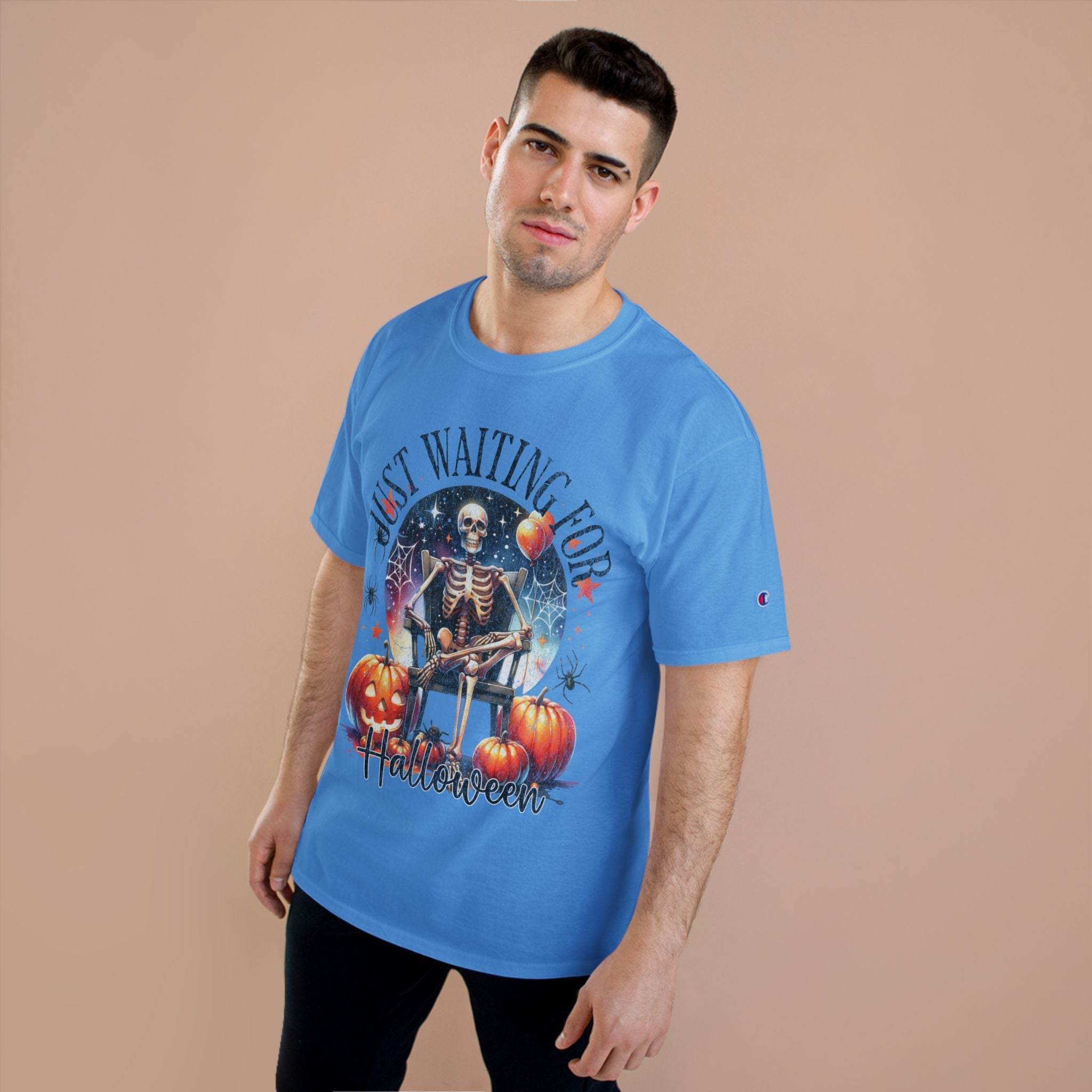 Printify eco-friendly Halloween t-shirt with skeleton and pumpkin design in blue worn by male model