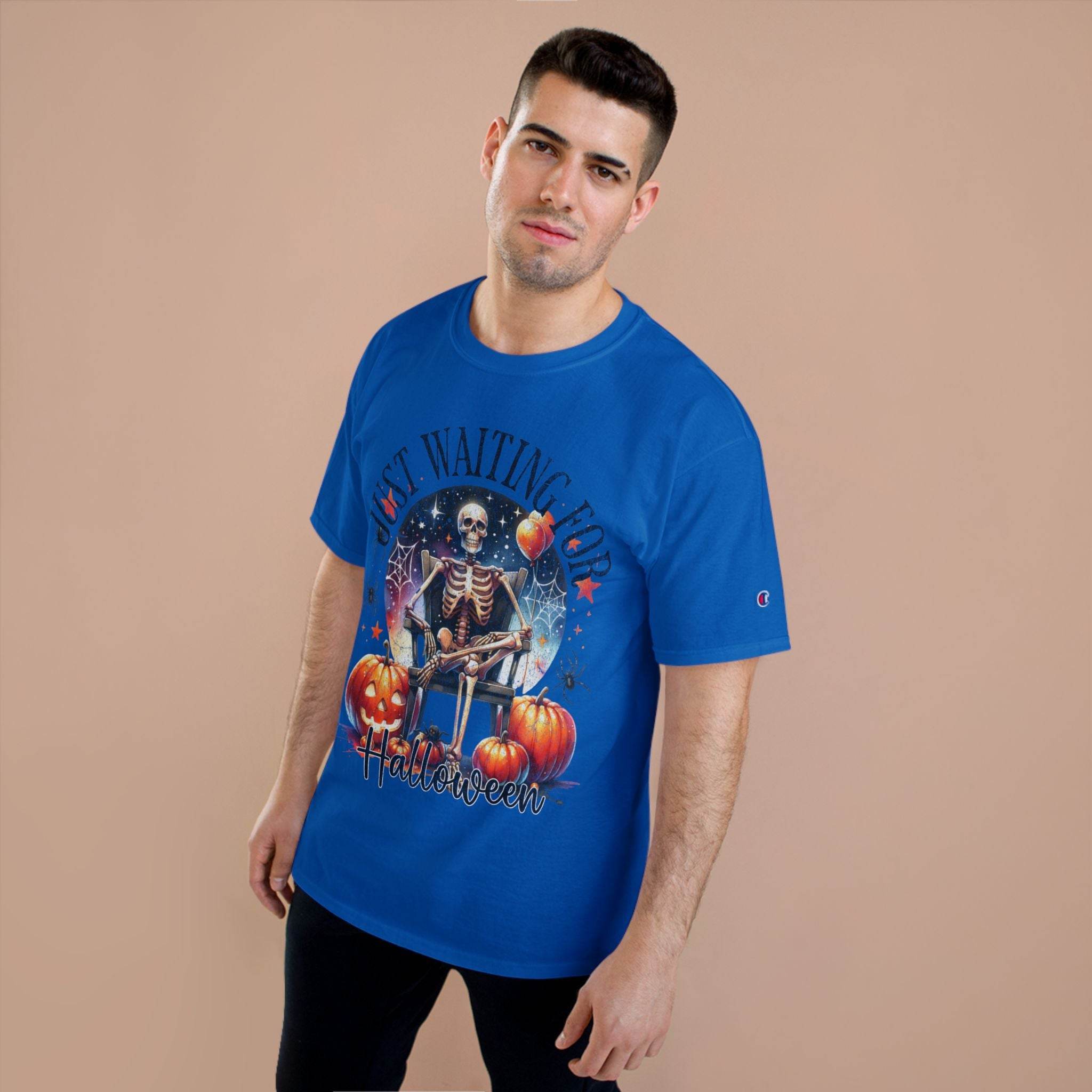 Printify blue eco-friendly Halloween t-shirt with skeleton and pumpkin design worn by male model