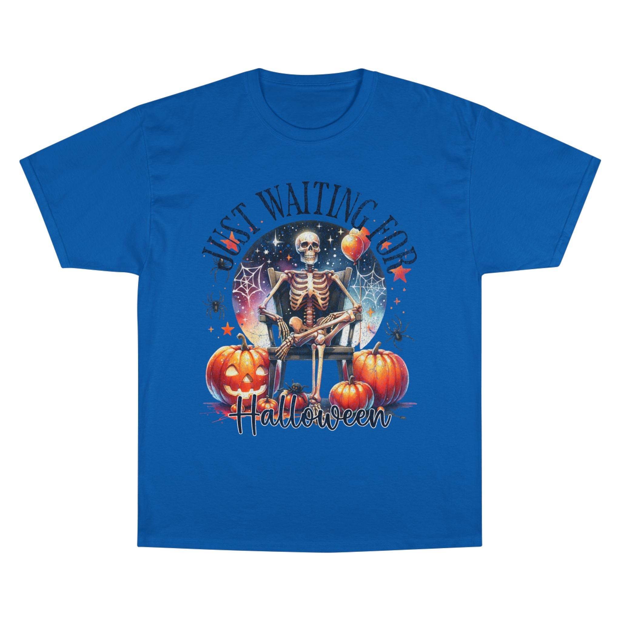 Printify blue eco-friendly Halloween t-shirt with skeleton sitting by pumpkins and spooky design