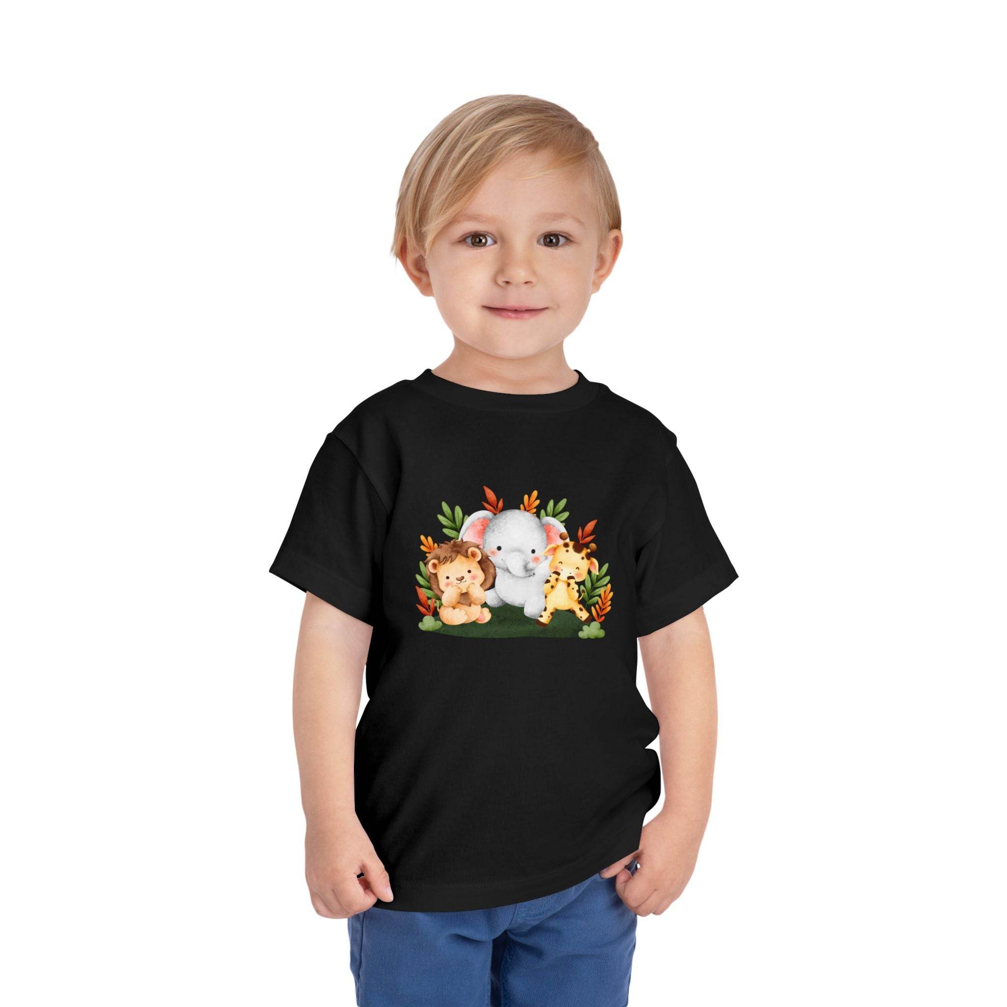 Printify black eco-friendly kids t-shirt with cute animal design worn by smiling toddler