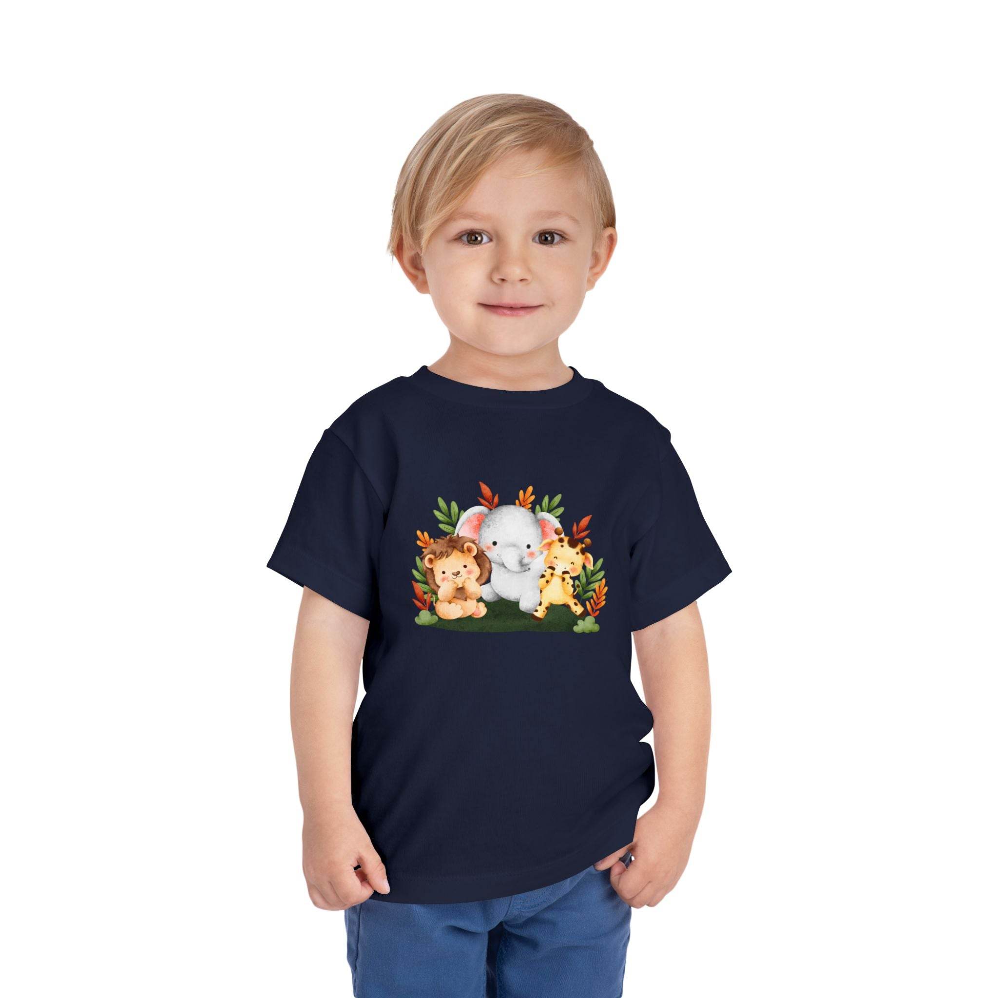 Young boy wearing a Printify eco-friendly kids t-shirt with cute animal print design