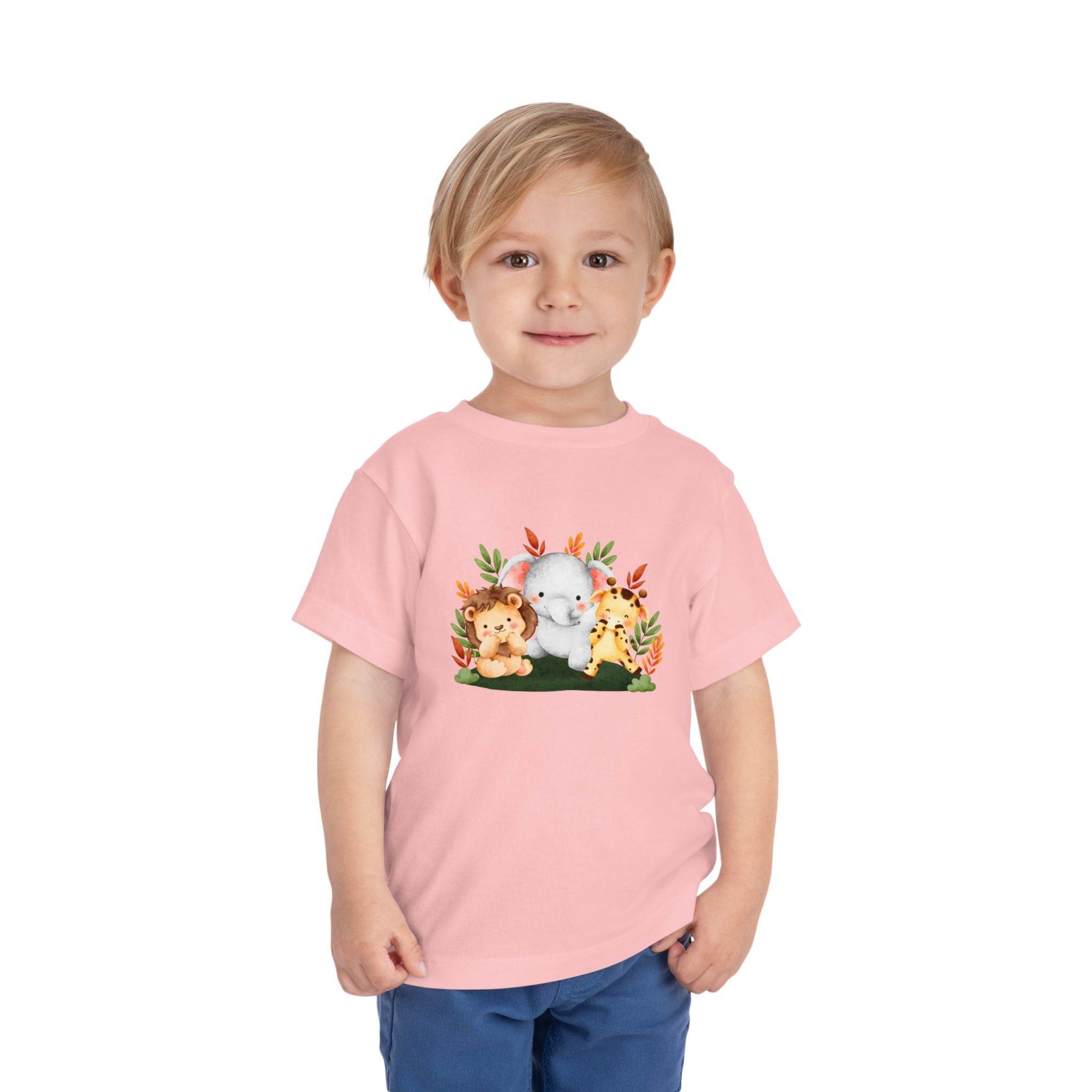 Eco-friendly kids t-shirt by Printify in pink with cute jungle animals graphic worn by child