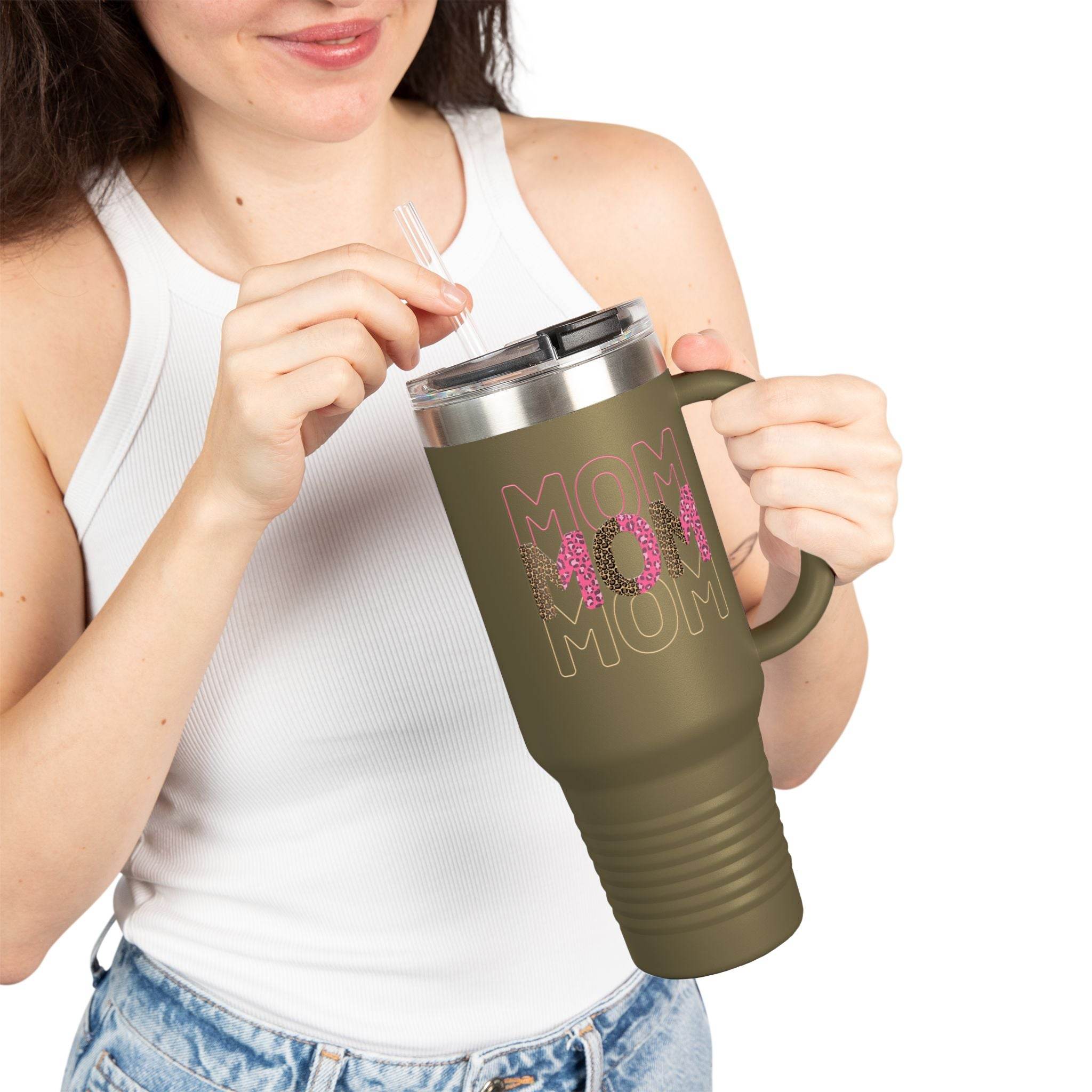 Printify eco-friendly mom travel mug in olive green with pink floral design held by woman in white tank top