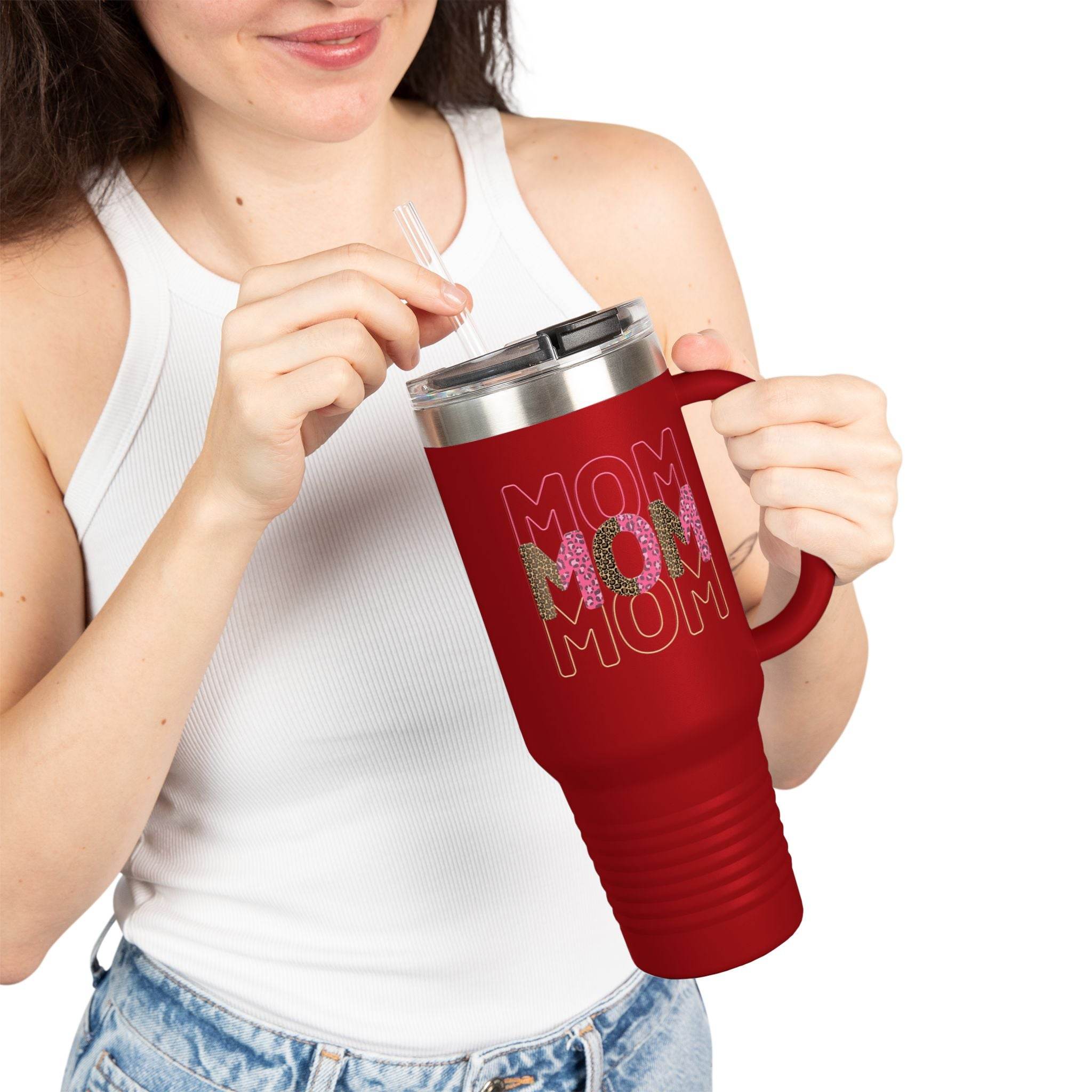 Red eco-friendly mom travel mug by Printify with handle and floral mom design held by woman