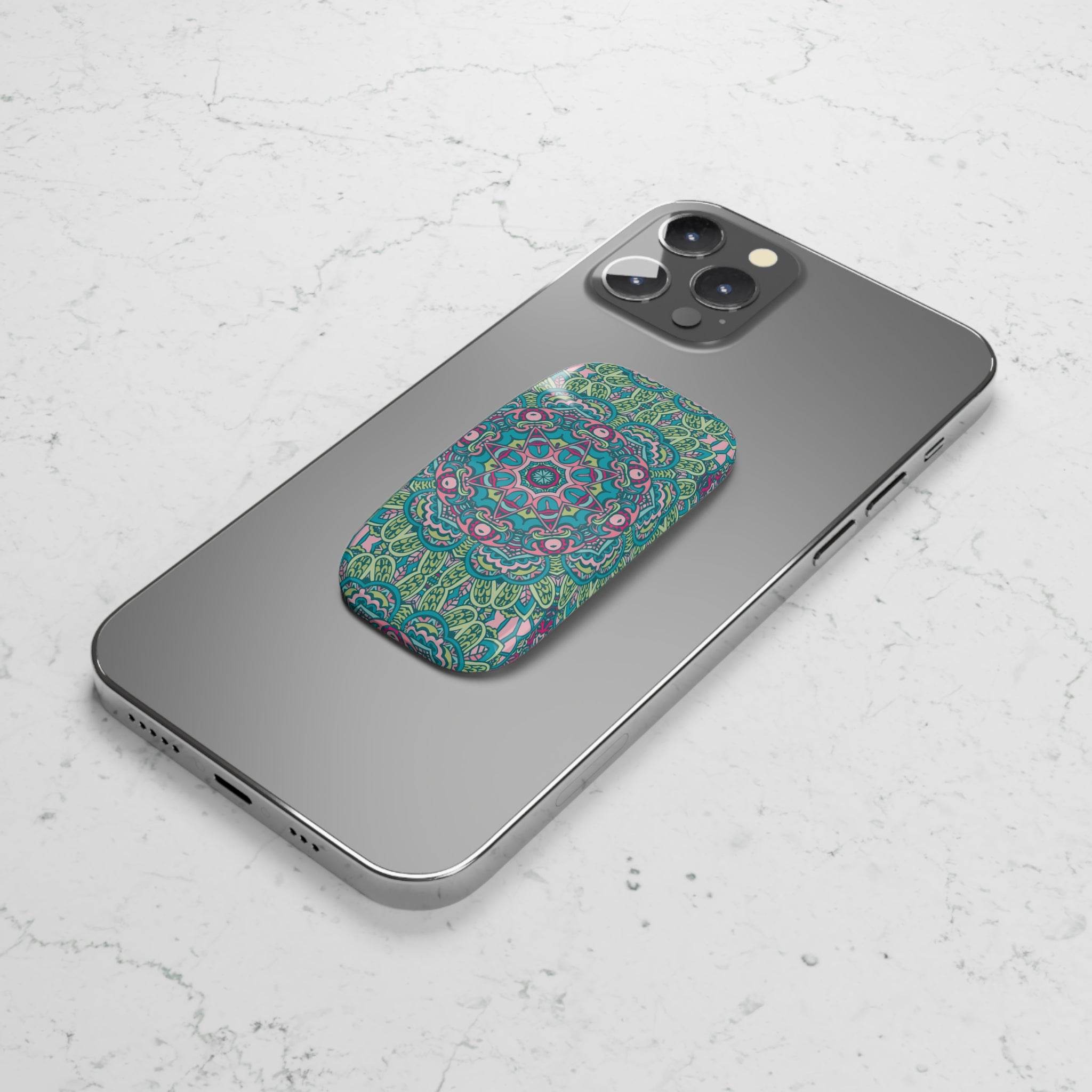 Printify eco-friendly phone grip with green and pink mandala design attached to the back of a modern smartphone