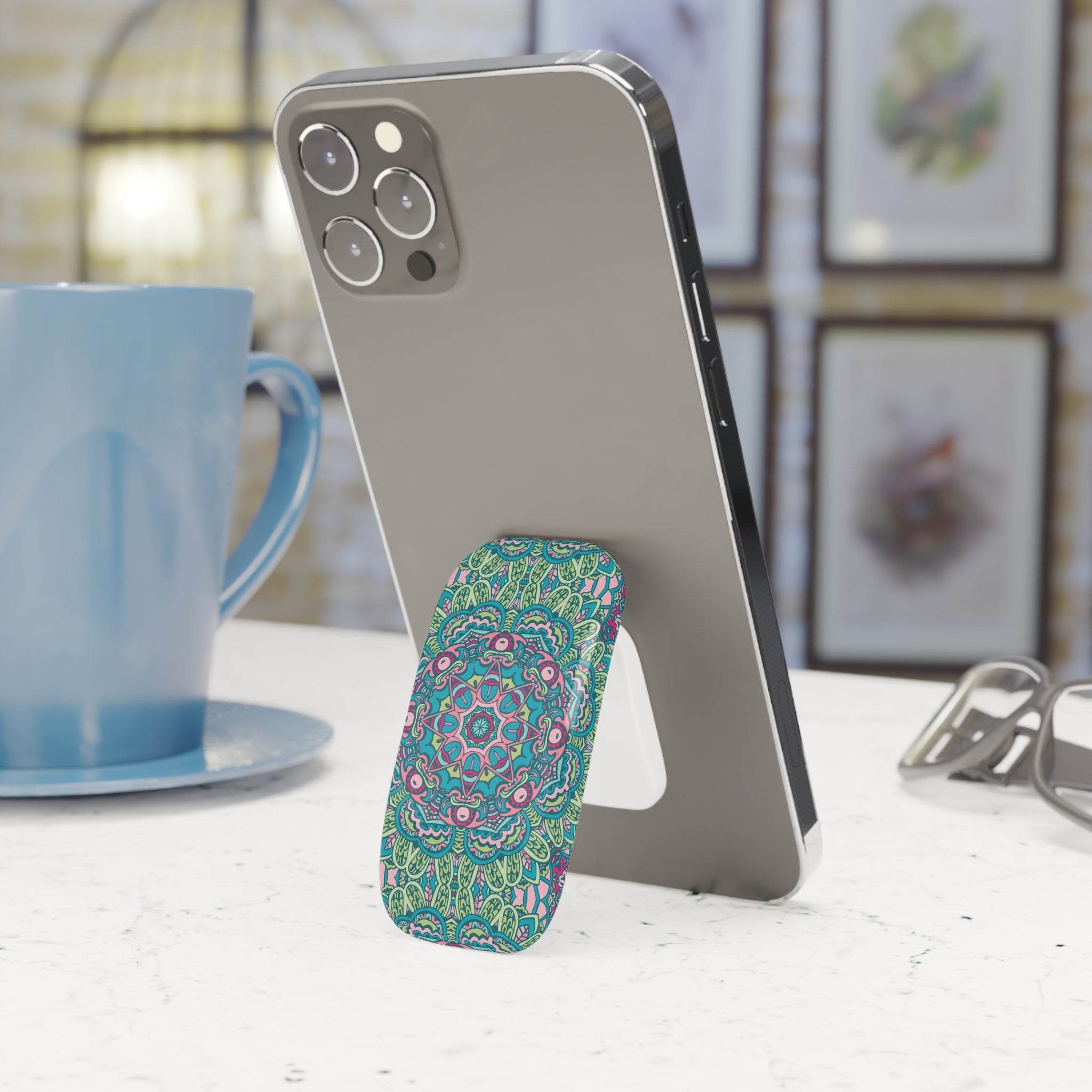 Printify eco-friendly phone grip with colorful mandala design attached to smartphone on white table