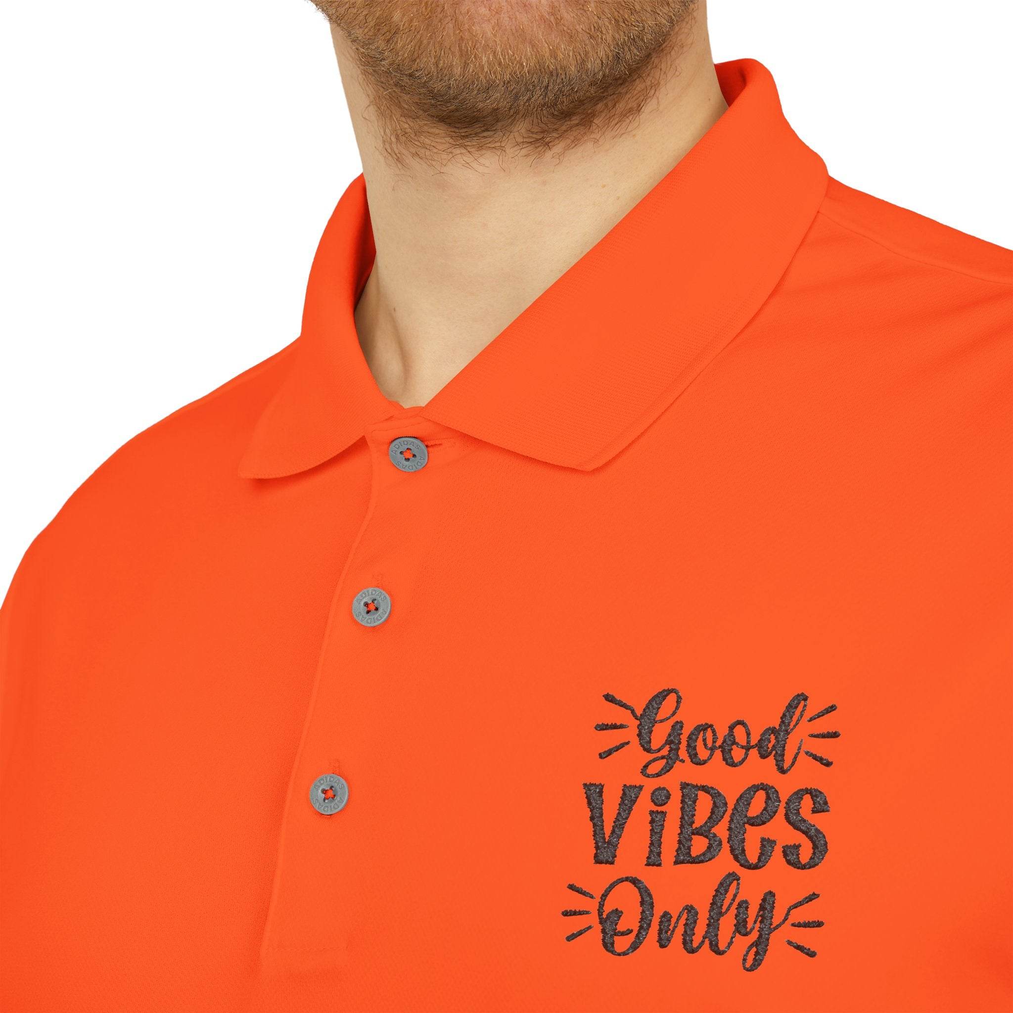 Orange eco-friendly polo shirt by Printify with Good Vibes Only text embroidery on chest
