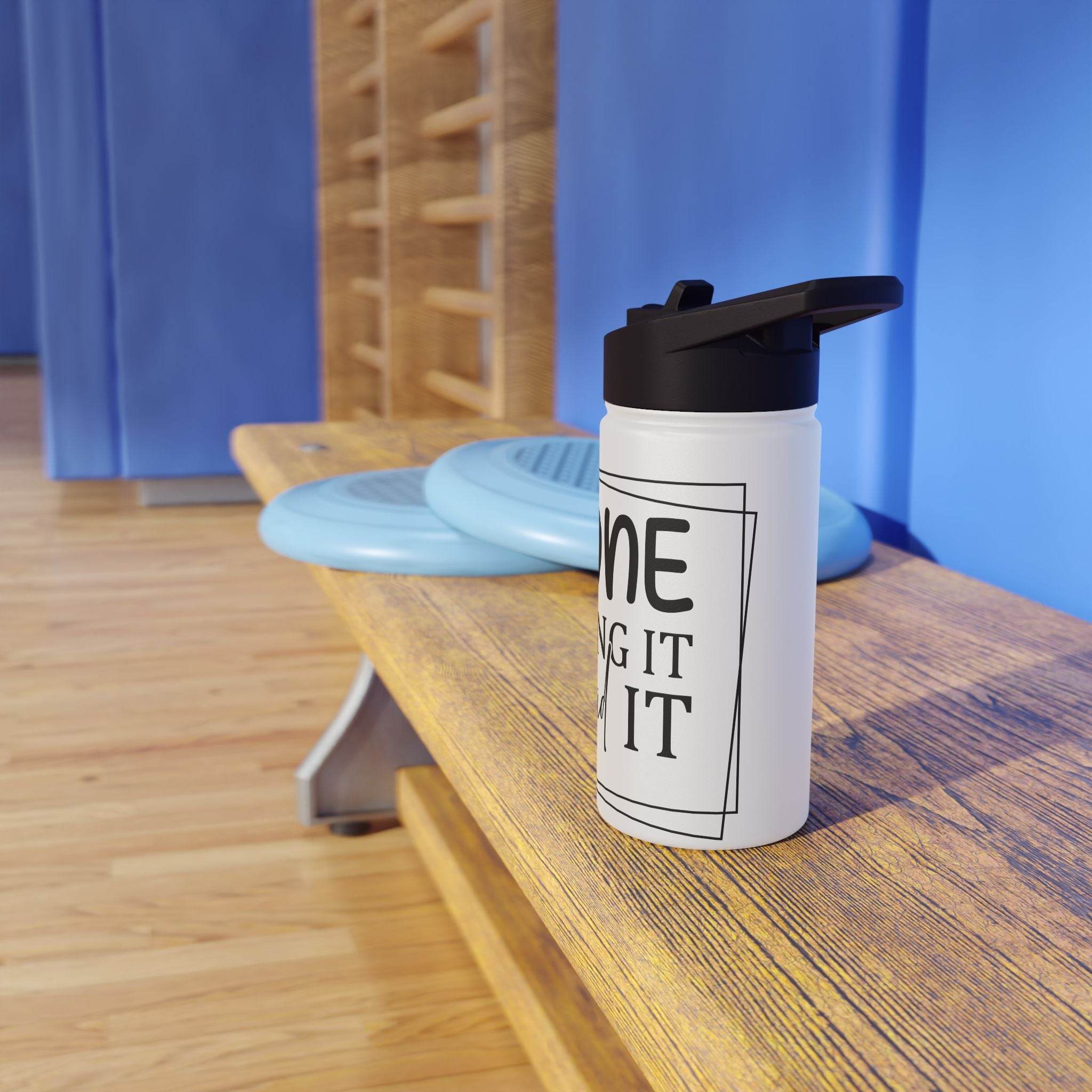 Printify eco-friendly stainless steel water bottle with black lid placed on wooden gym bench