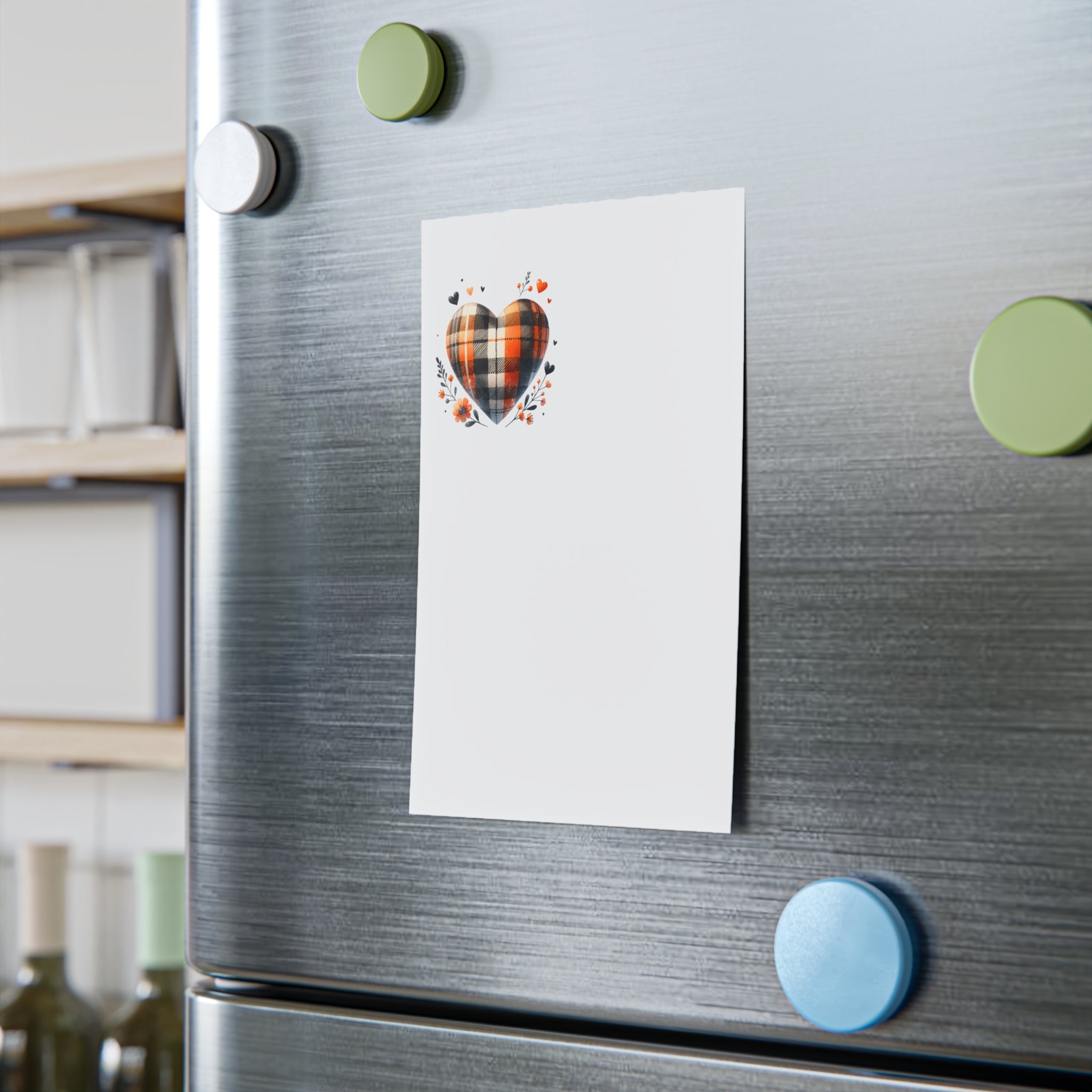 Eco-friendly sticky notes with a plaid heart design attached to a stainless steel fridge using round colorful magnets