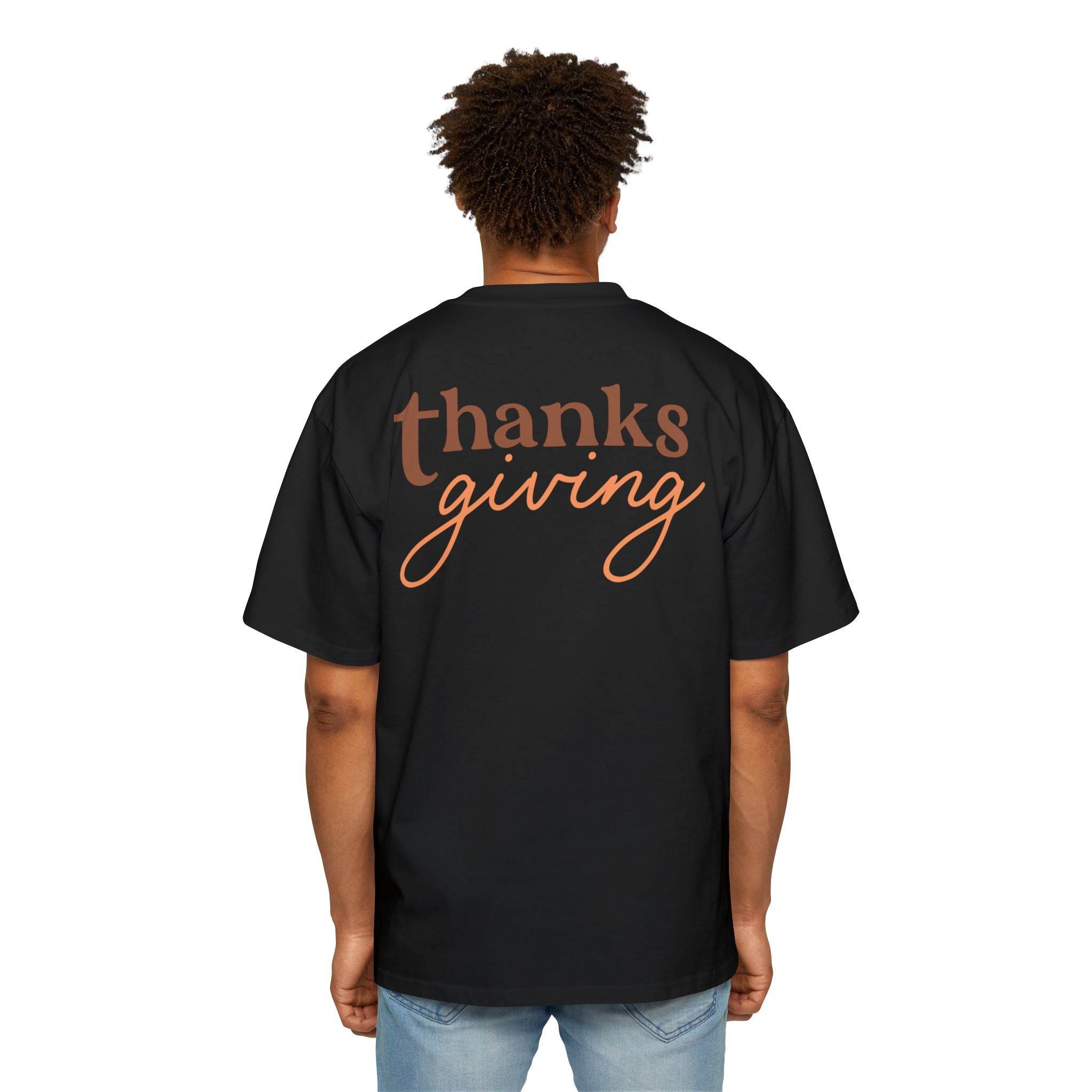 Black Printify eco-friendly Thanksgiving shirt men with brown and orange thanksgiving text on back