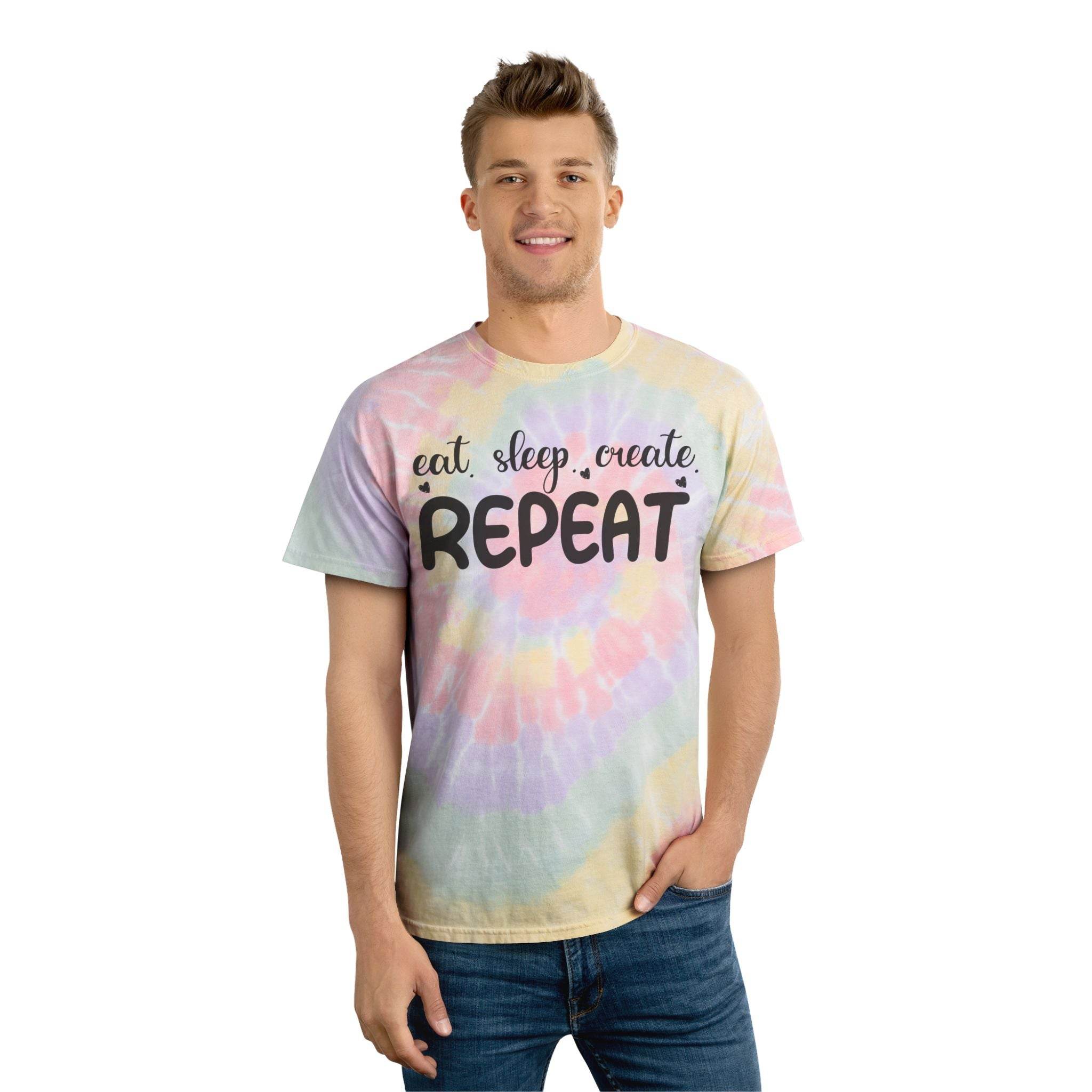 Printify eco-friendly tie-dye t-shirt with eat sleep create repeat slogan worn by smiling man