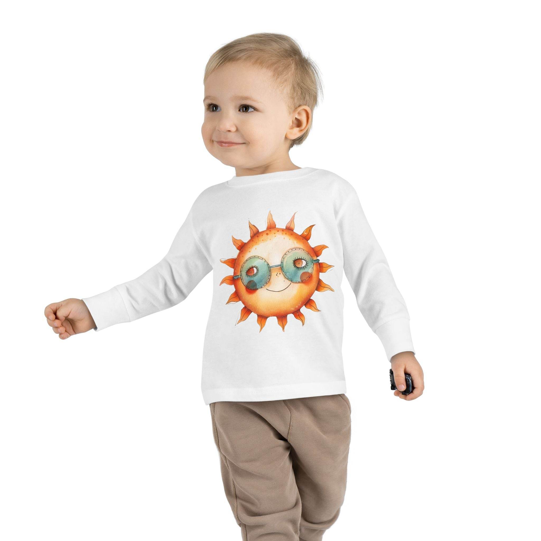 Toddler wearing eco-friendly toddler long sleeve shirt with sun and sunglasses graphic by Printify