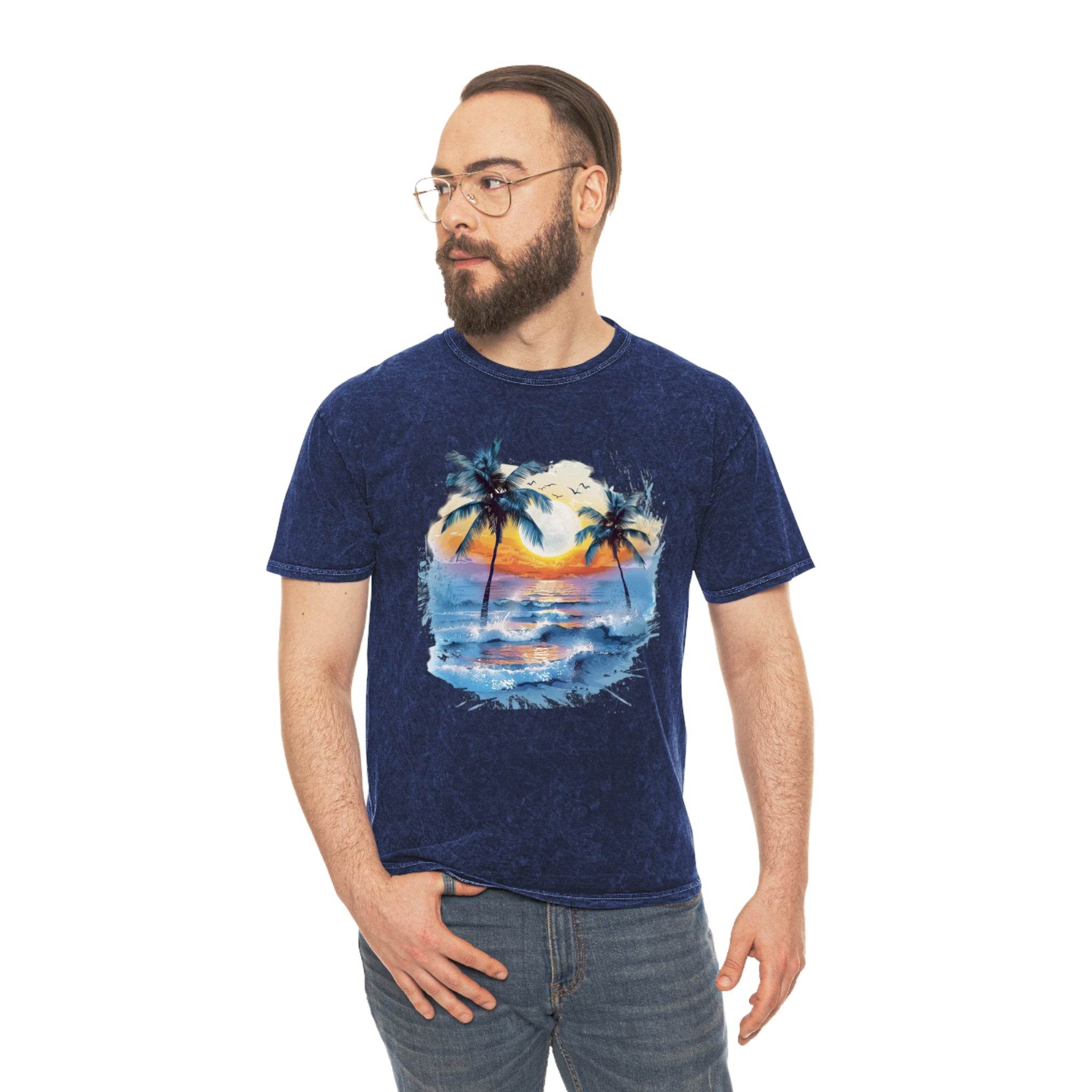 Man wearing a Printify eco-friendly tropical t-shirt with palm trees and sunset ocean design