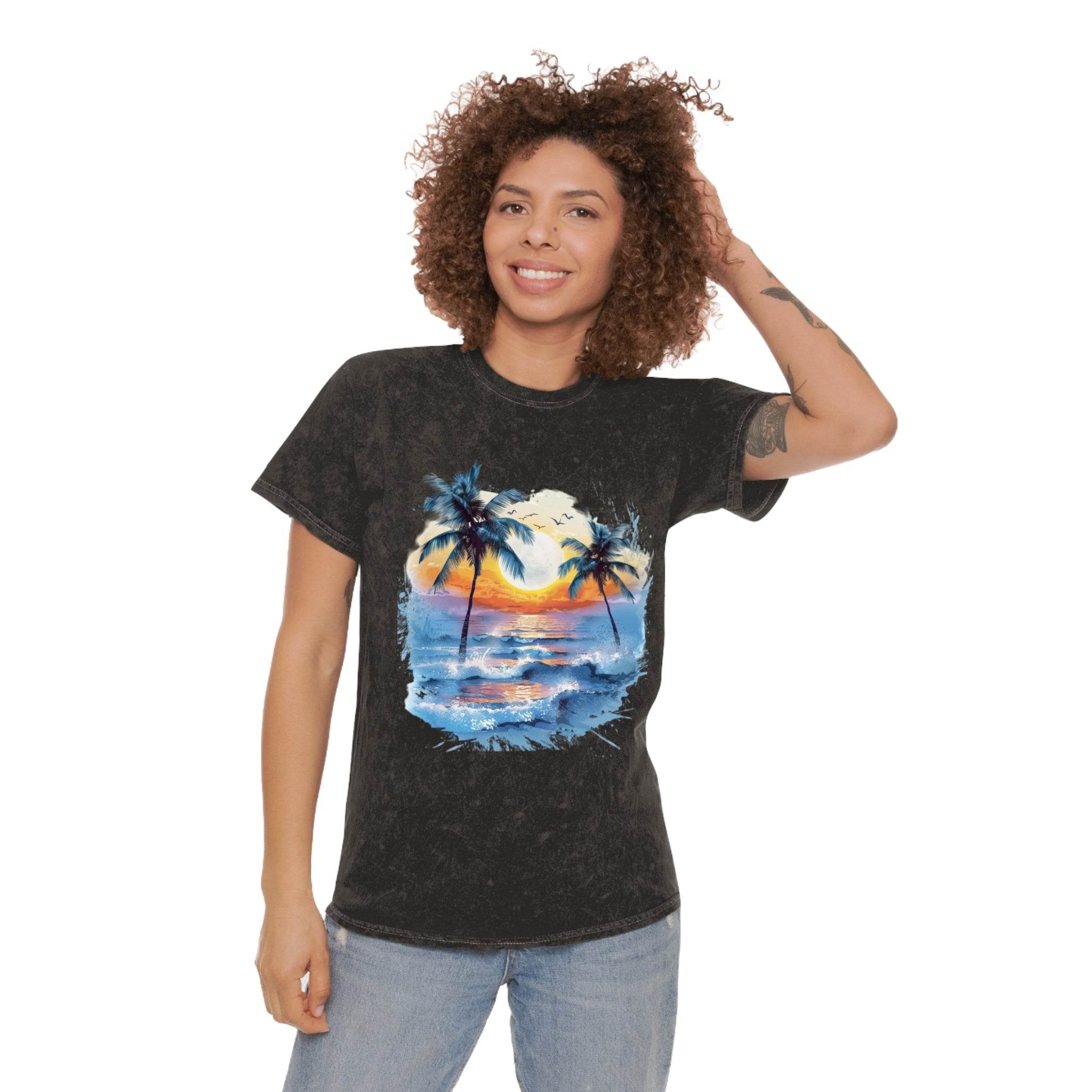 Woman wearing Printify eco-friendly tropical t-shirt with a sunset and palm tree design