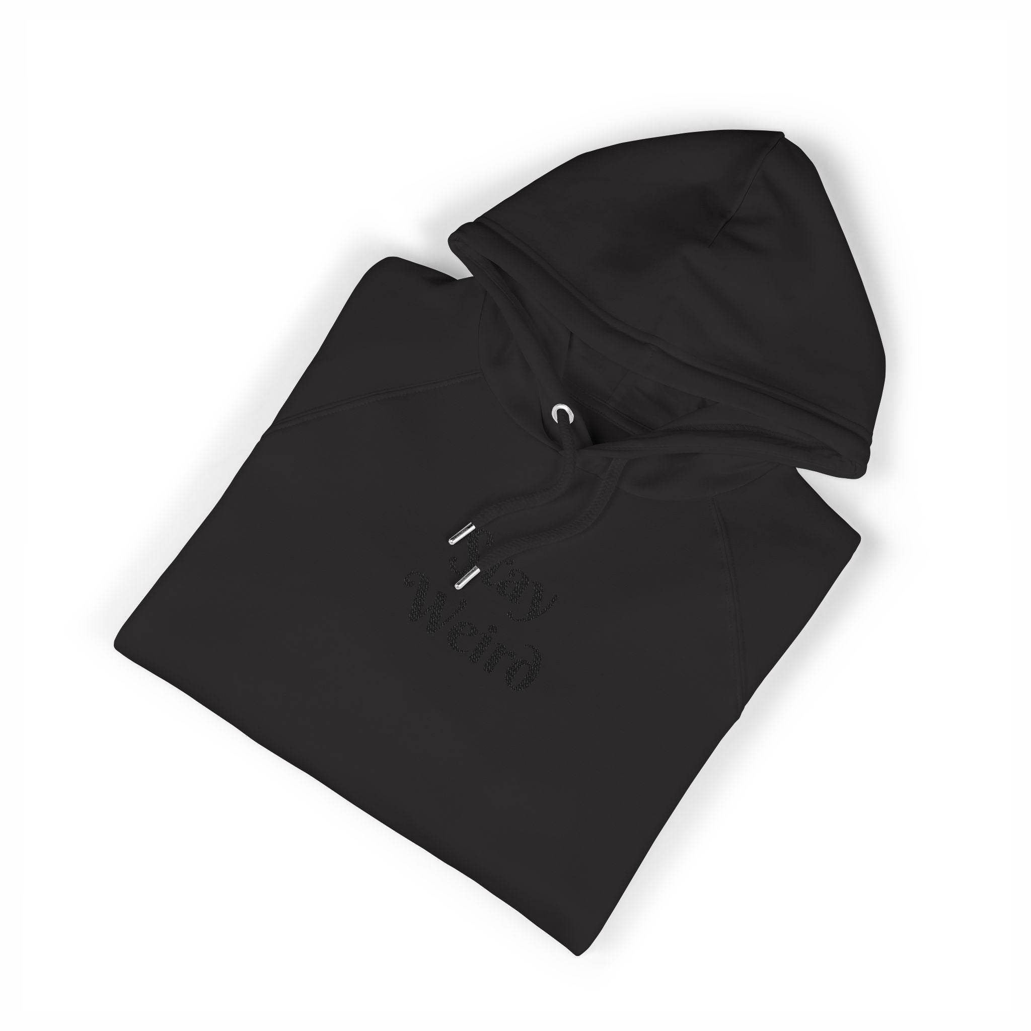 Black eco friendly unisex hoodie by Printify folded with drawstrings and hood visible