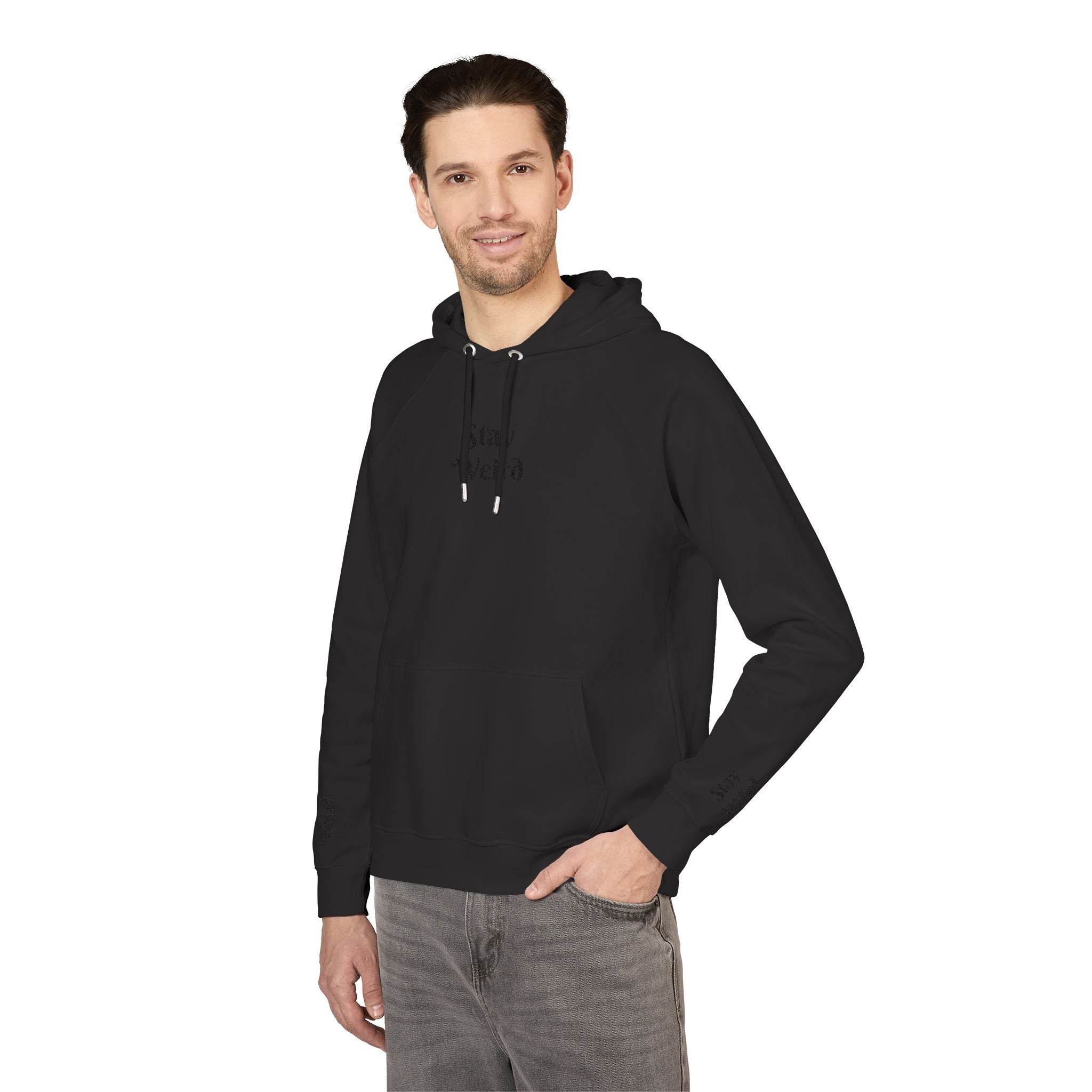 Man wearing a black eco friendly unisex hoodie by Printify with front pocket and adjustable drawstrings