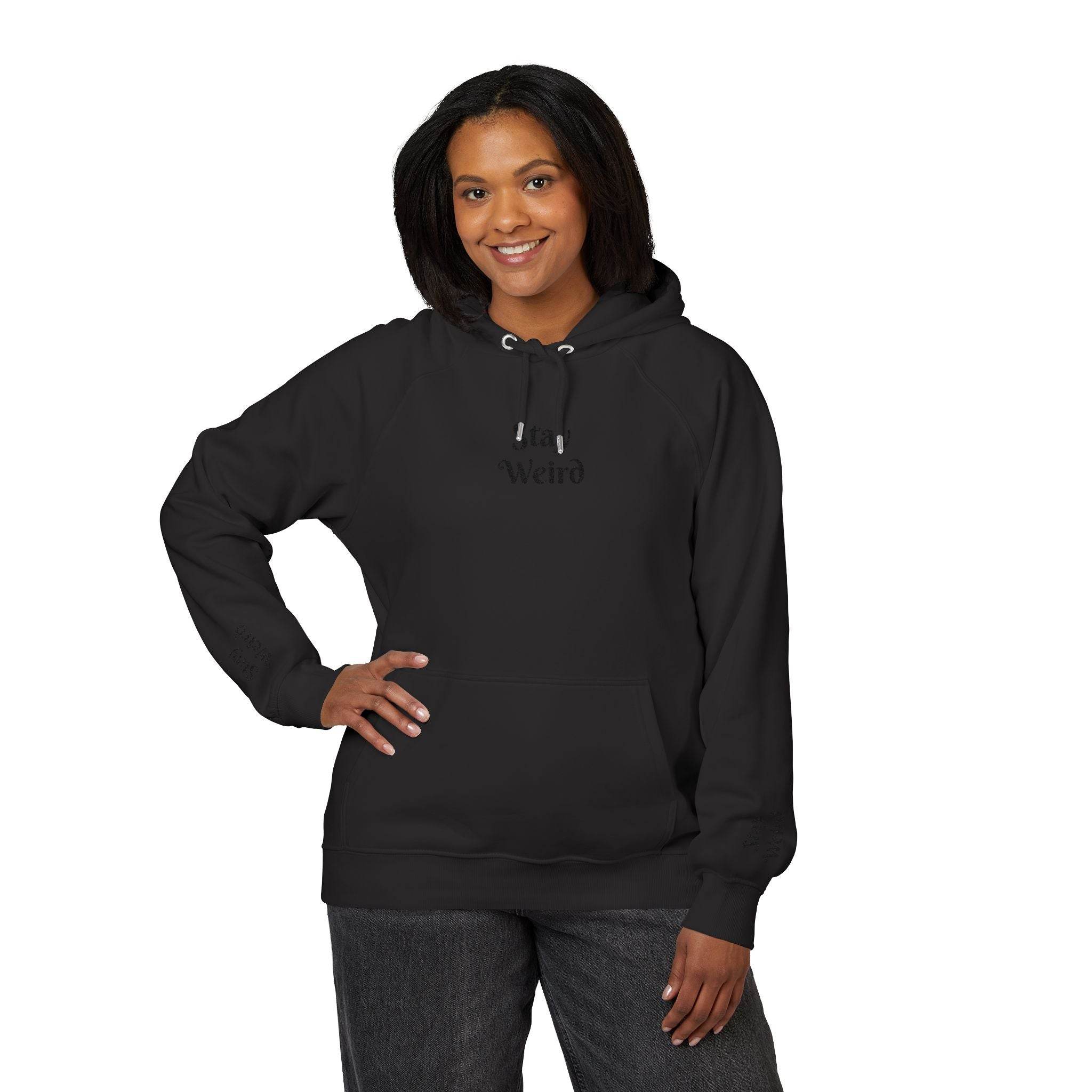 Black Printify eco friendly unisex hoodie worn by smiling woman with front pocket and drawstring hood