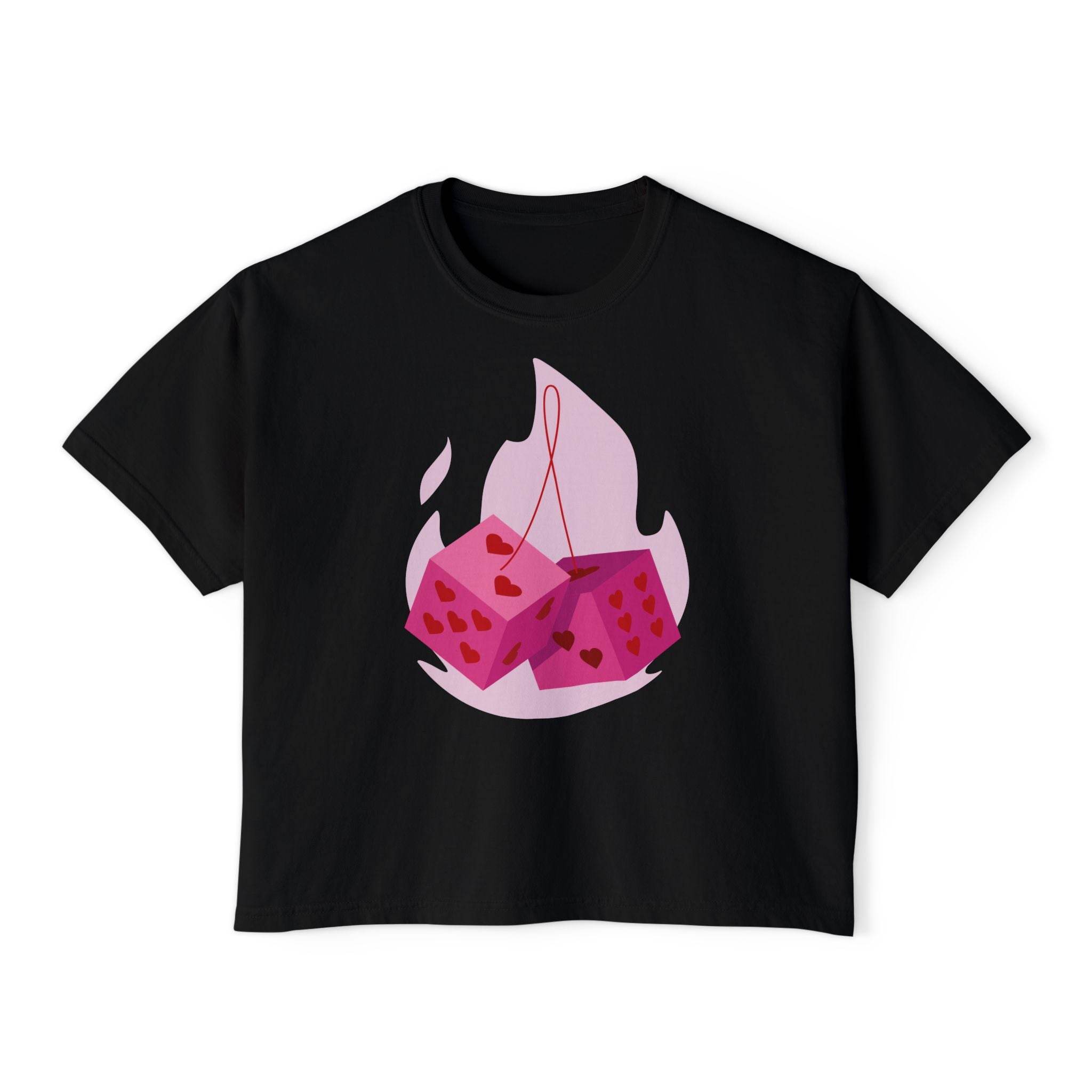 Black eco-friendly women boxy tee from Printify featuring pink dice with heart patterns design