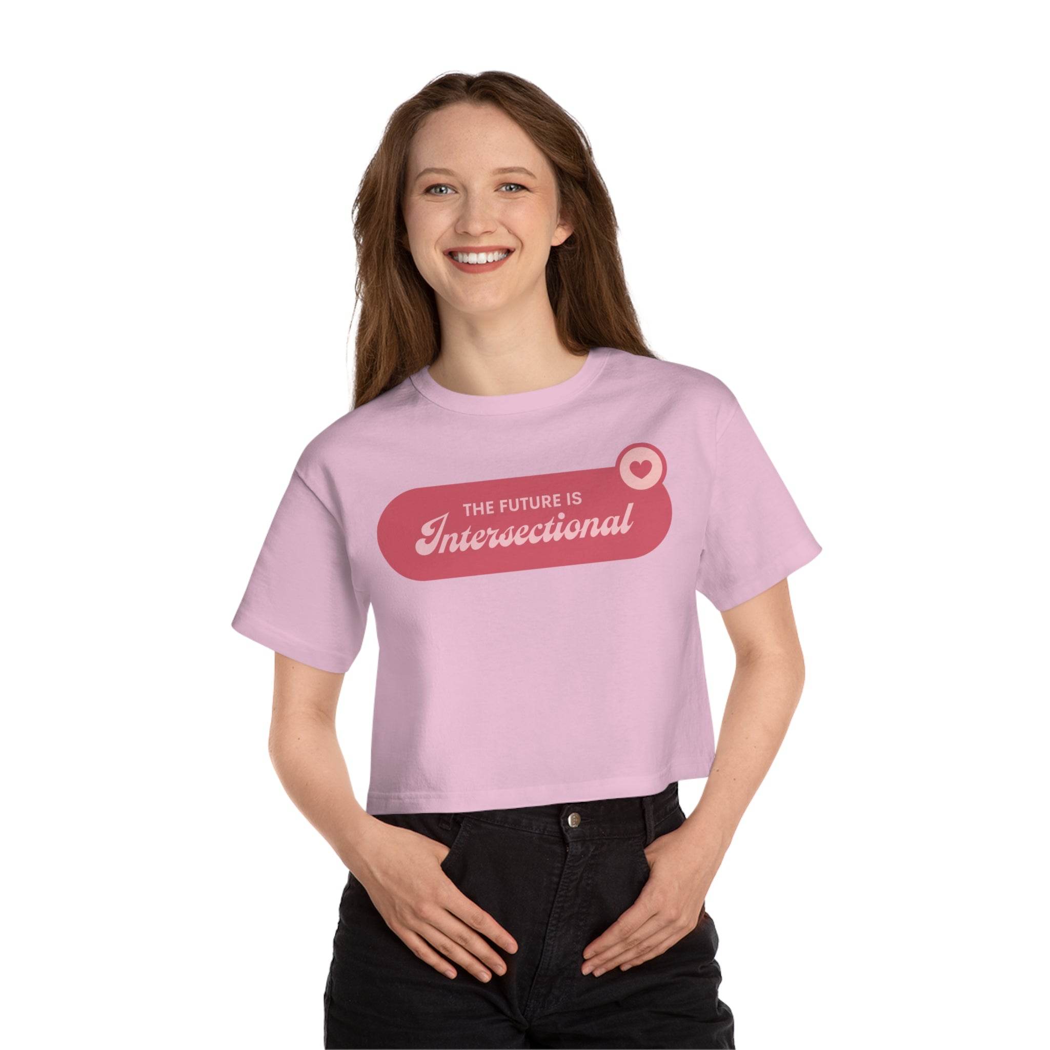Printify eco-friendly women cropped t-shirt in light pink with The Future is Intersectional graphic