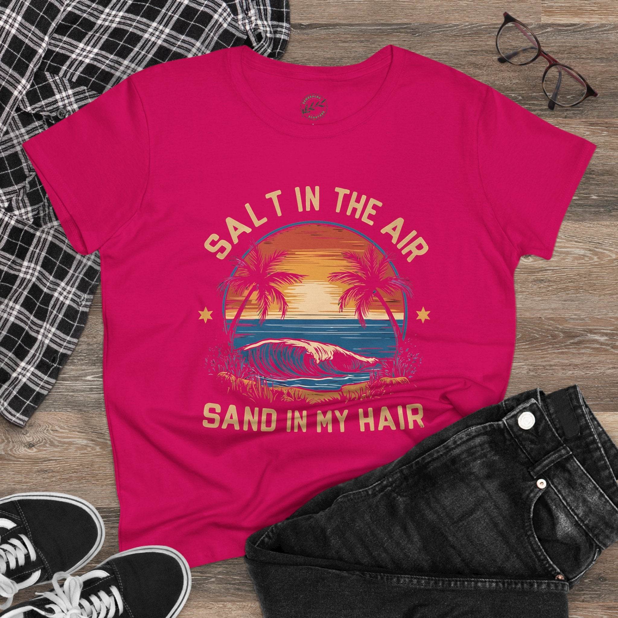 Eco-friendly women's cotton tee in pink with sunset beach graphic and Salt in the Air Sand in My Hair text